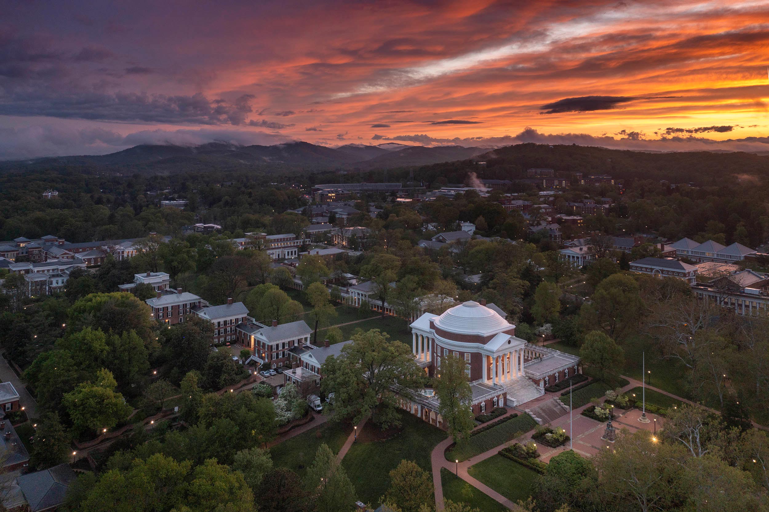 An aerial shot of a colorful sunset over UVA Grounds.