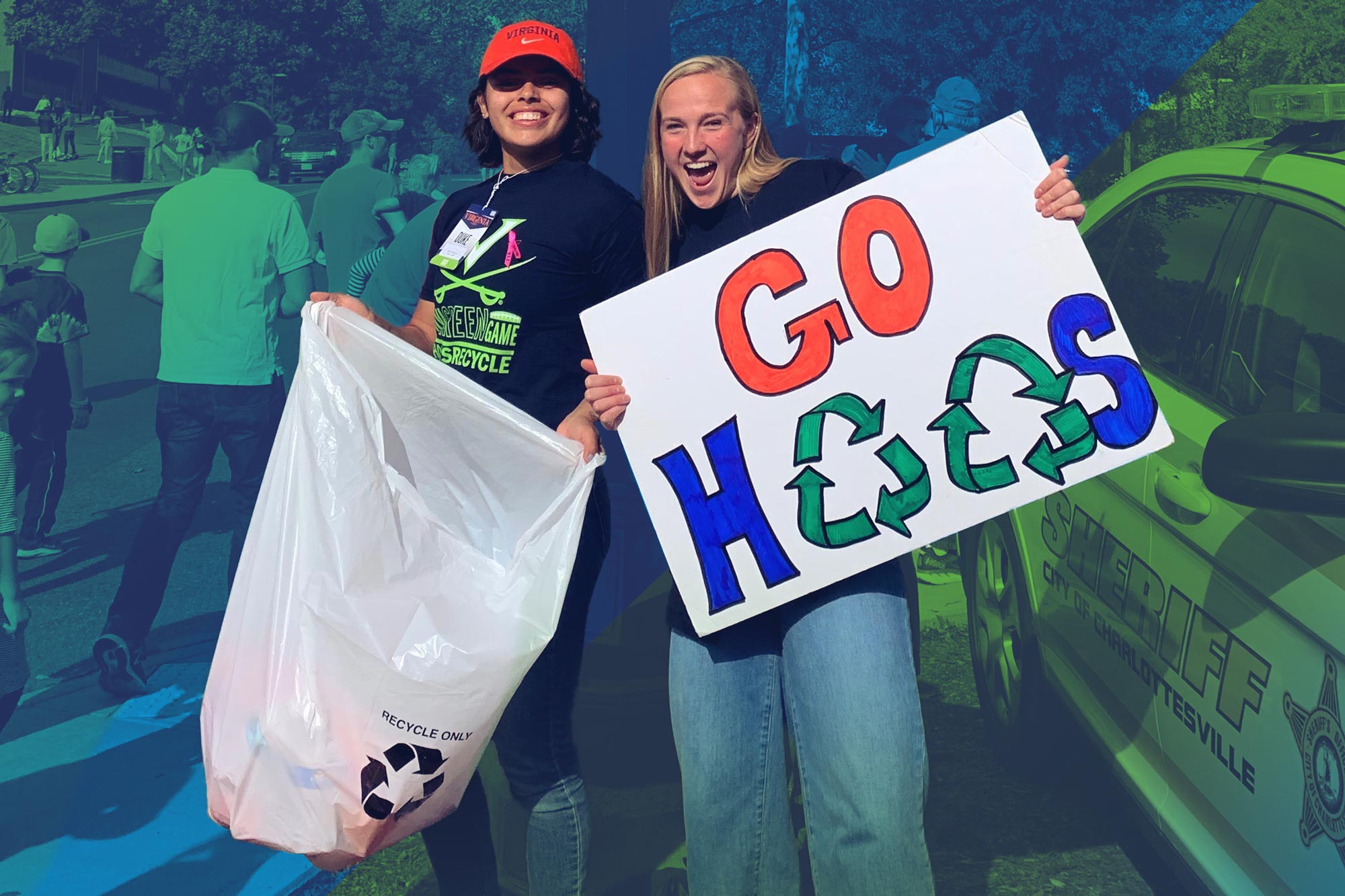 A UVA student holds a plastic recycling bag next to another student holding a sign that reads Go Hoos. The O's in Hoos are recycling symbols.