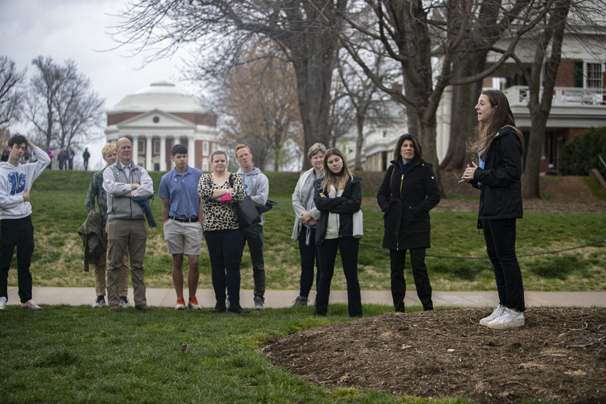 A tour of Grounds on the Lawn with the Rotunda in the background.