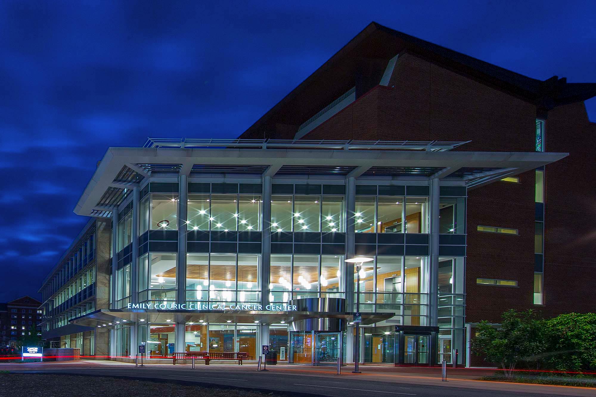Exterior of the UVA Cancer Center building at night