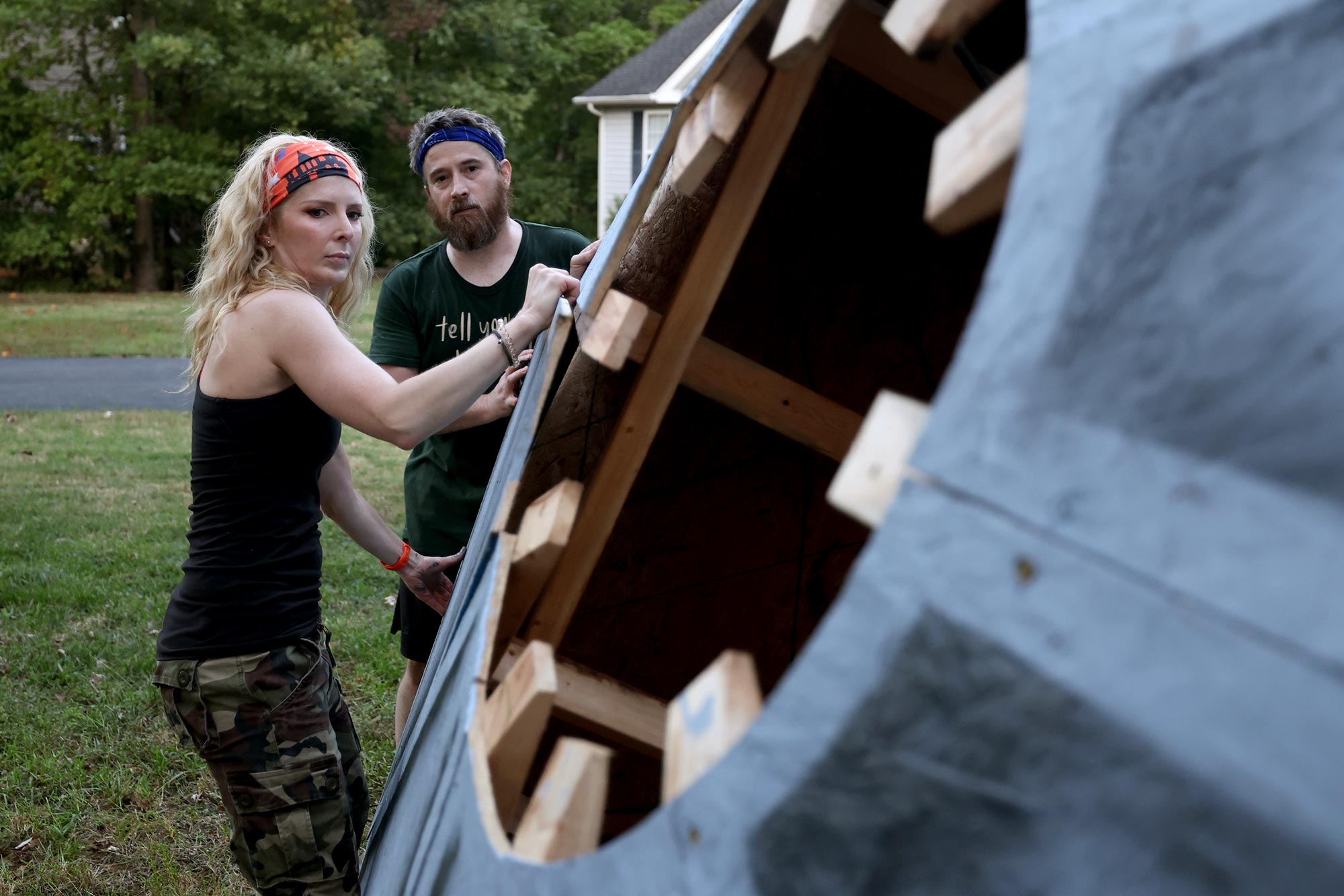 The Mingledorffs building a crashed UFO out of wood and styrofoam.