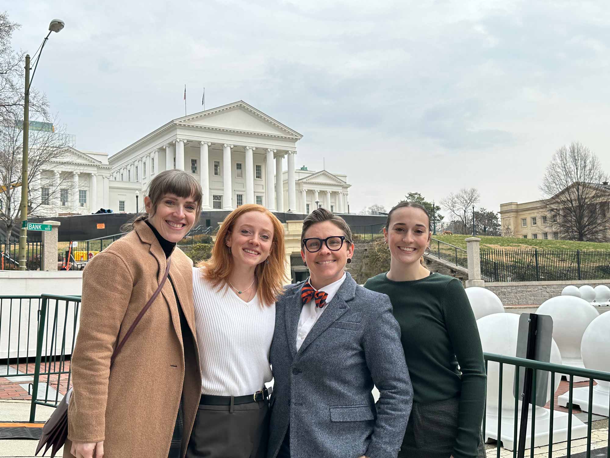 Assistant professor of nursing Ashley Apple poses with  students in Richmond 