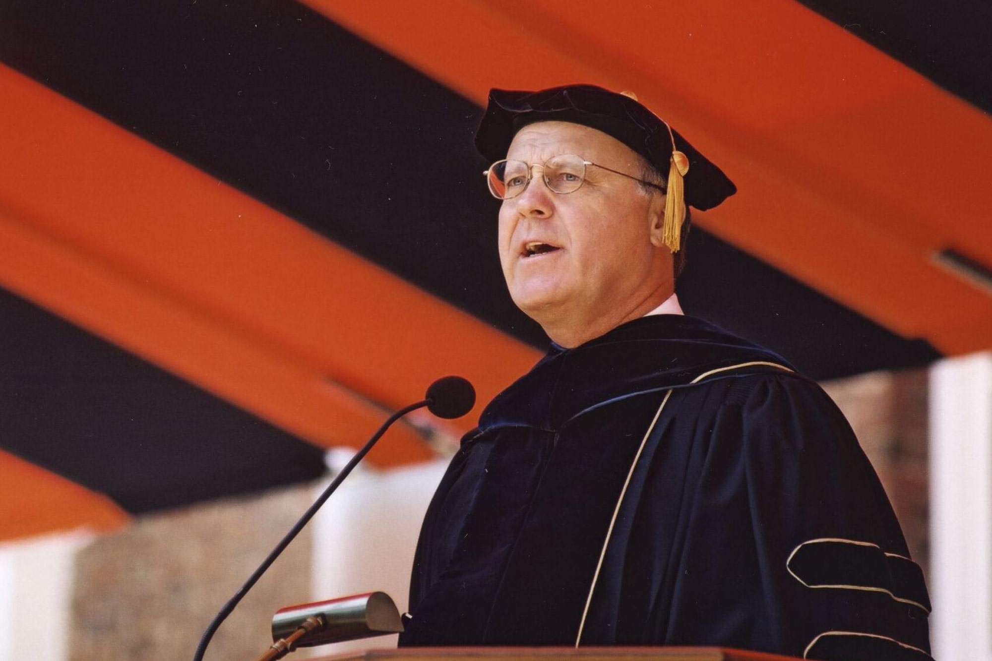 John T. Casteen III, standing at podium during Final Exercises giving a speech