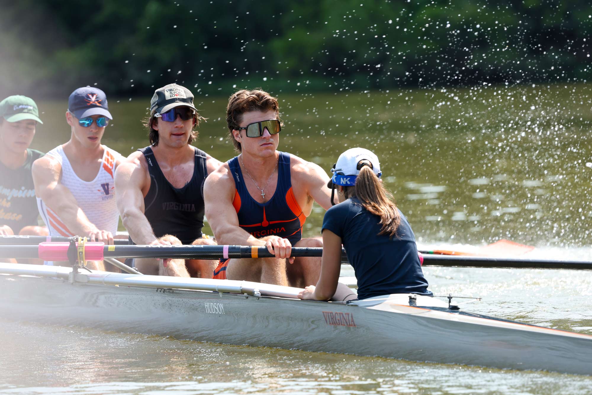 Close up of the front of the UVA club rowing team on the water