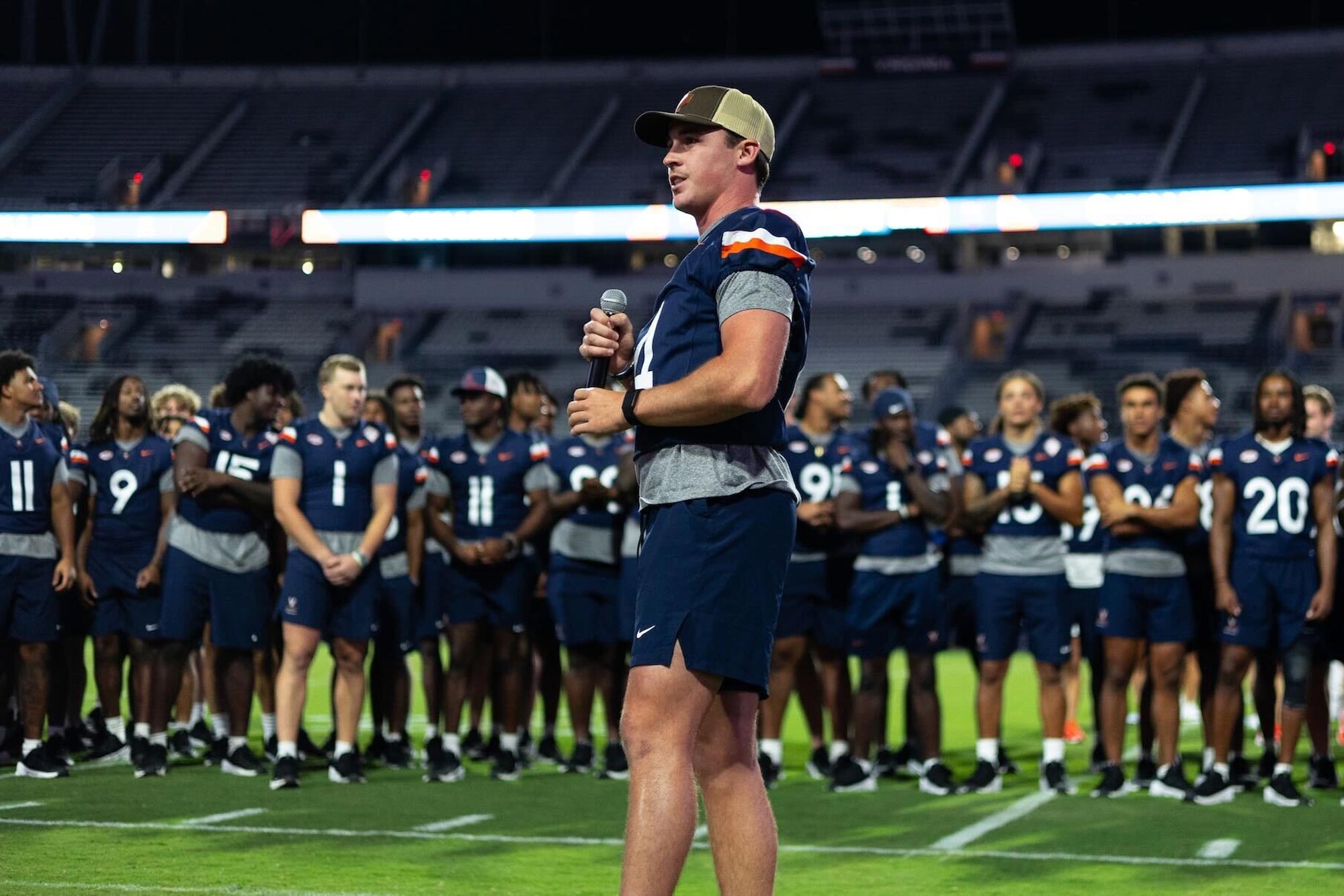 Chandler Morris speaking to the UVA football team and crowd