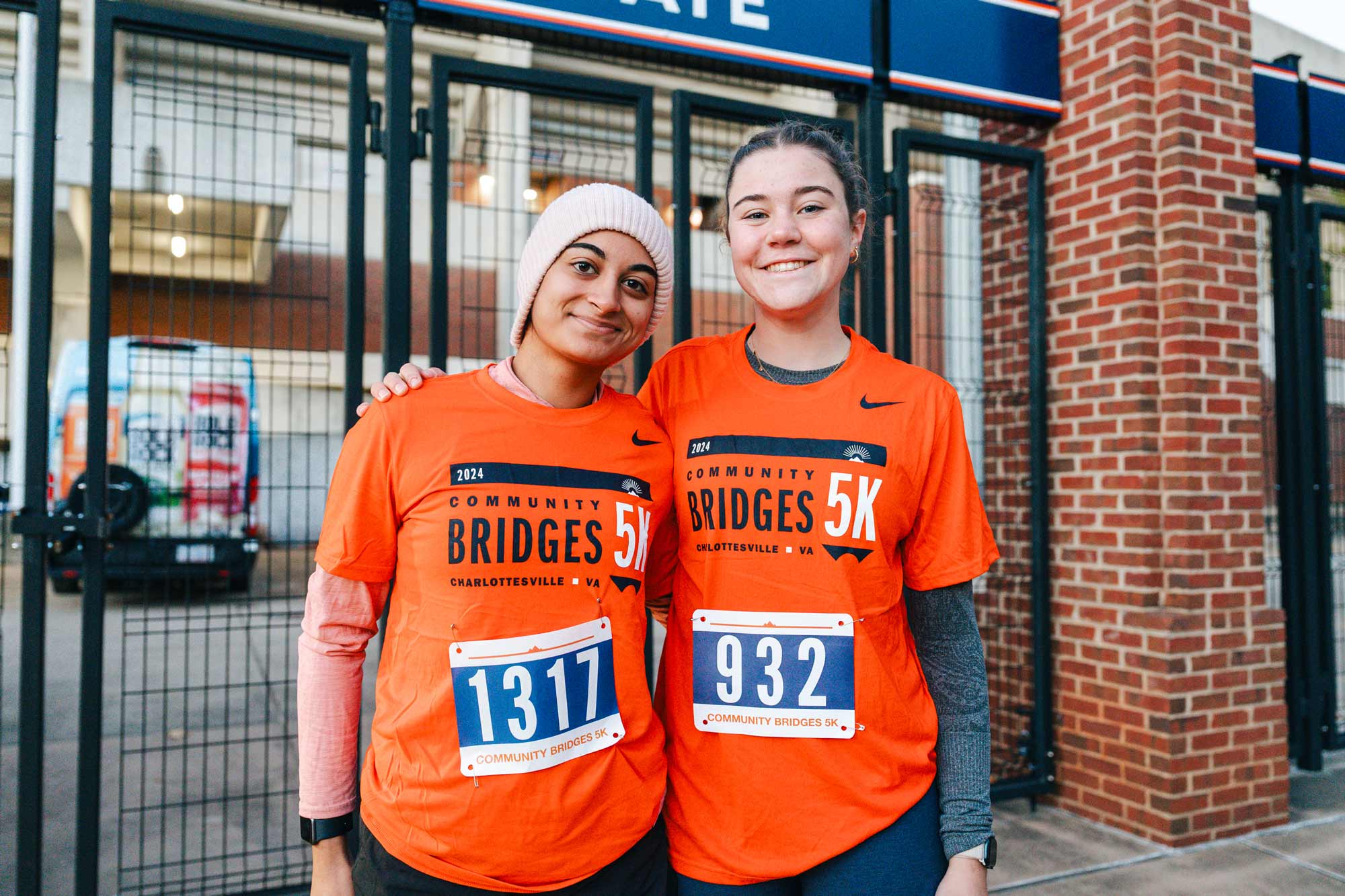 Two individuals pose together before setting off on the run