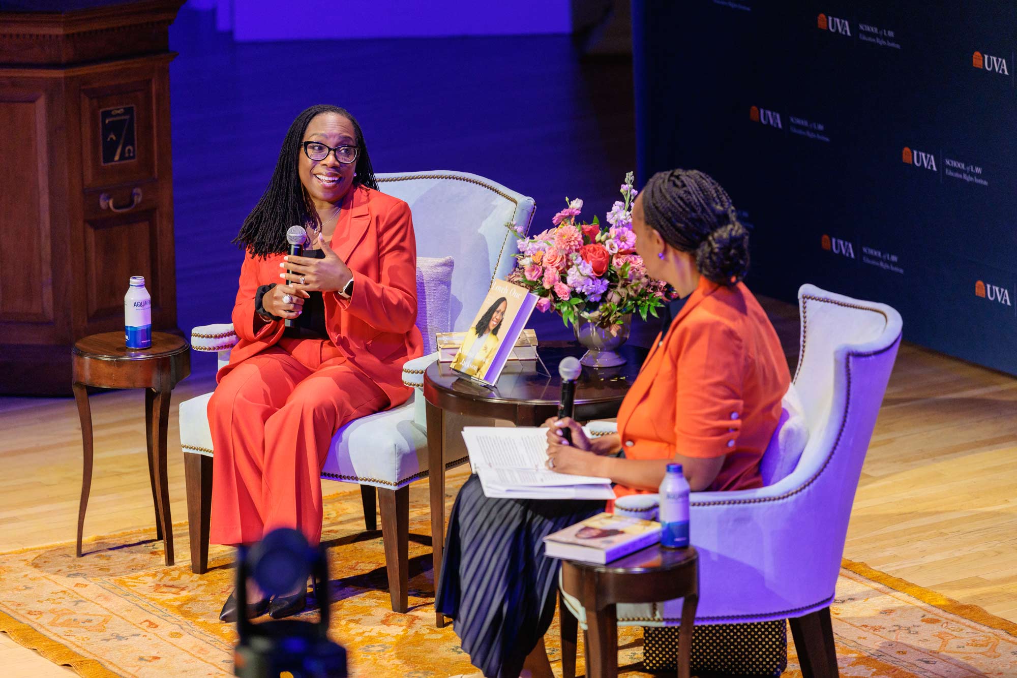 Supreme Court Justice Ketanji Brown Jackson and Kimberly Jenkins Robinson sitting on a stage at the UVA School of Law
