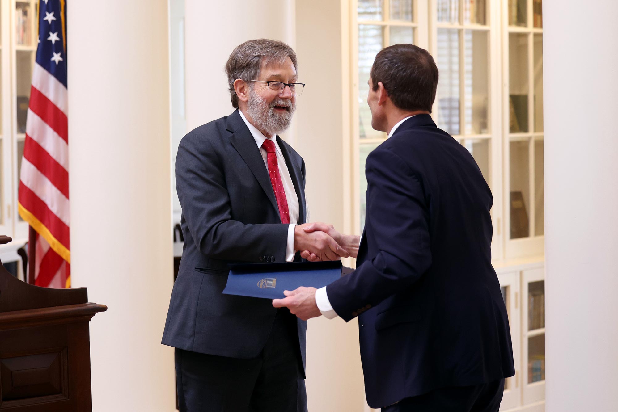 Deputy Solicitor General Edwin S. Kneedler being giving an award from President Jim Ryan