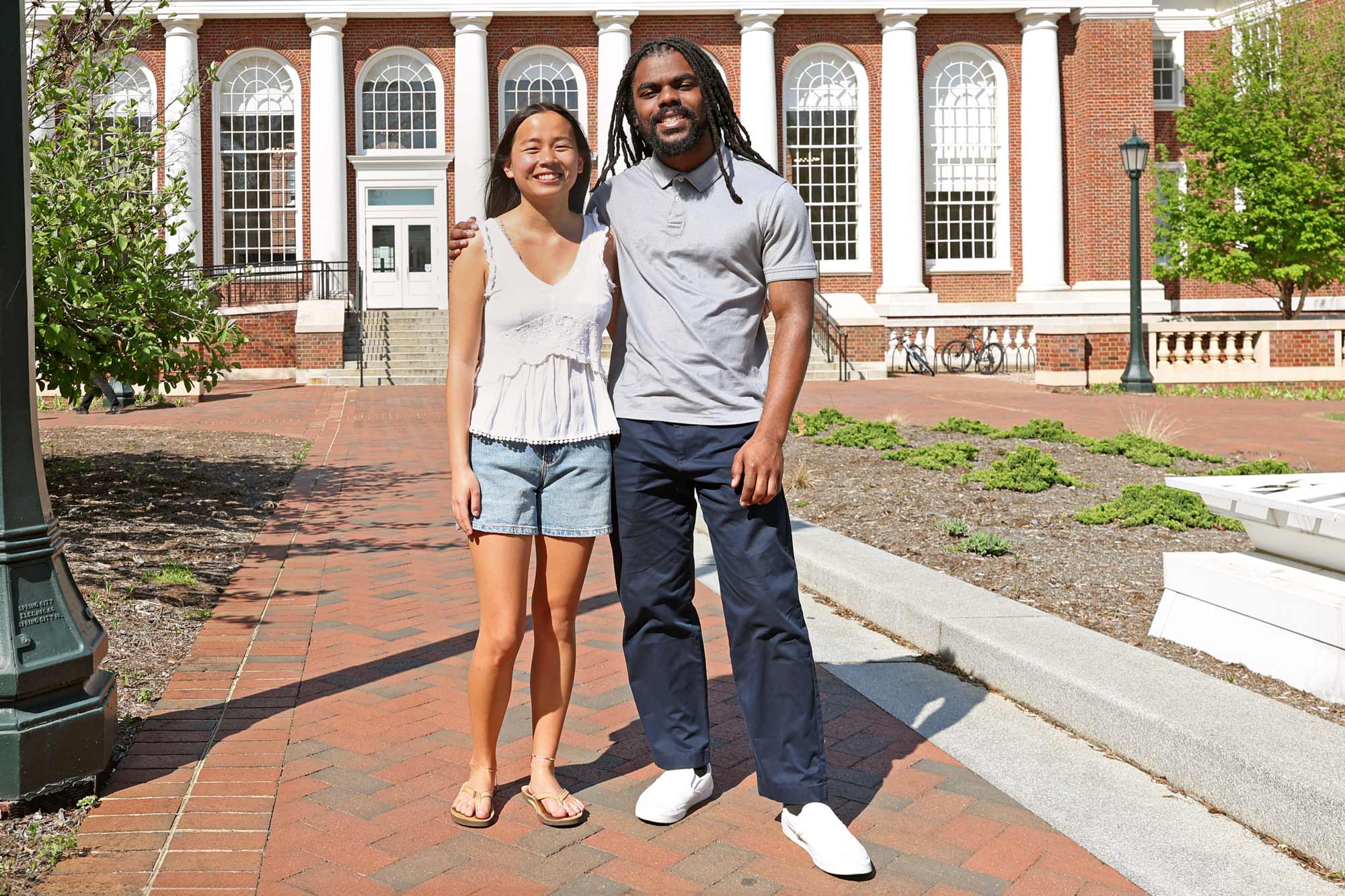 Andrew Spencer and SuLing Llanes-Trexler posing outside of Shannon Library