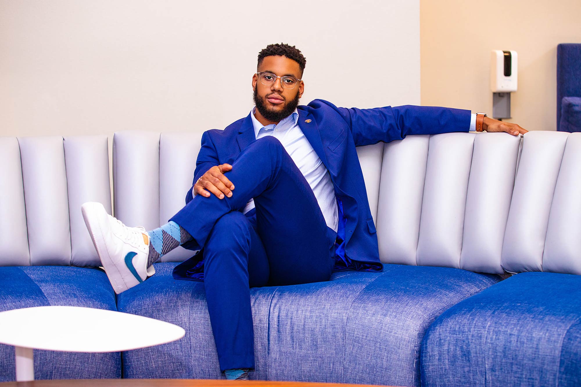 Braxton sitting on a couch posed for a portrait