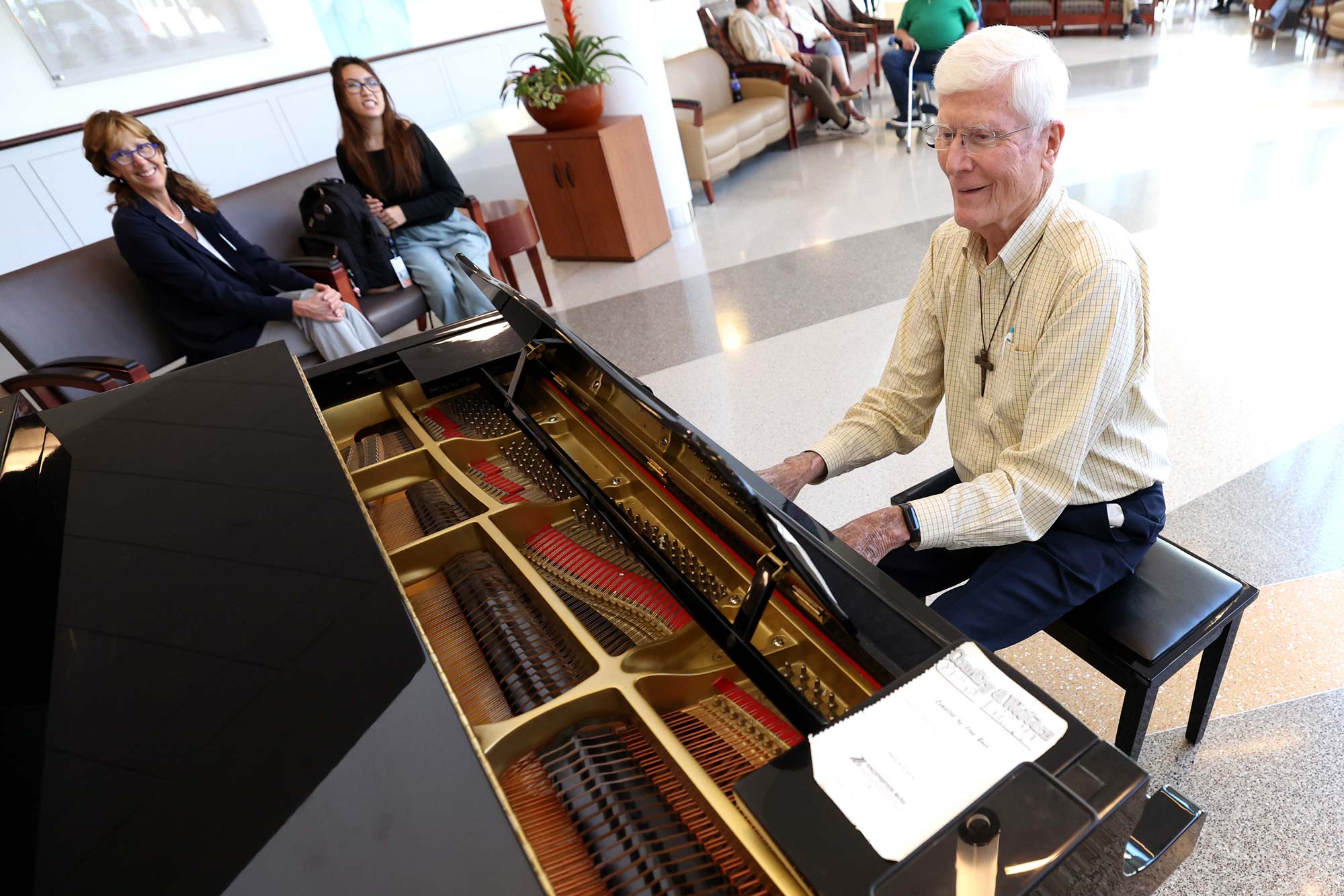 Portrait of Kyle Clements playing piano.