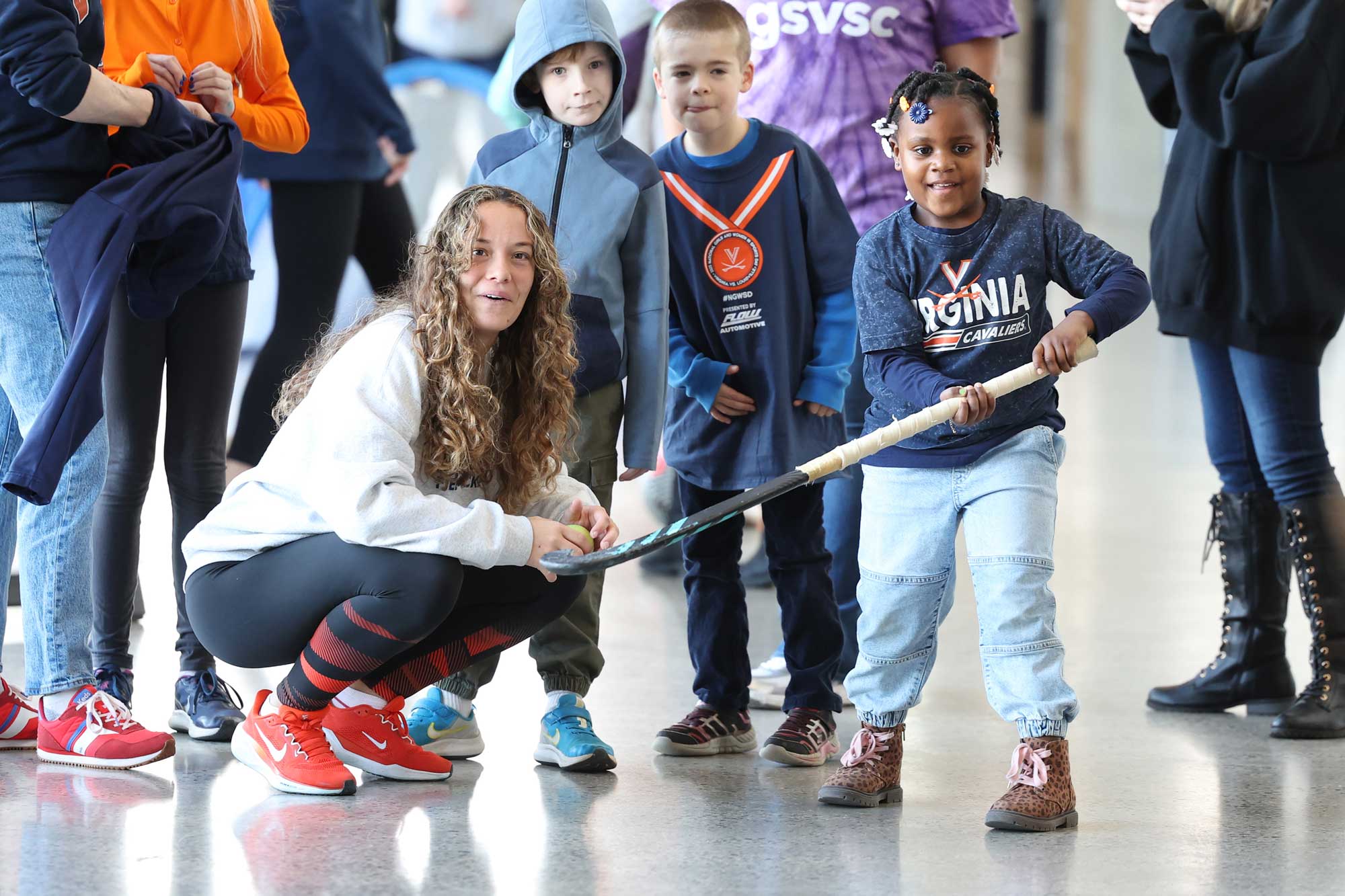 Freshman Catalina Quinteros, a midfielder on the UVA field hockey team, introduces young fans to her sport.