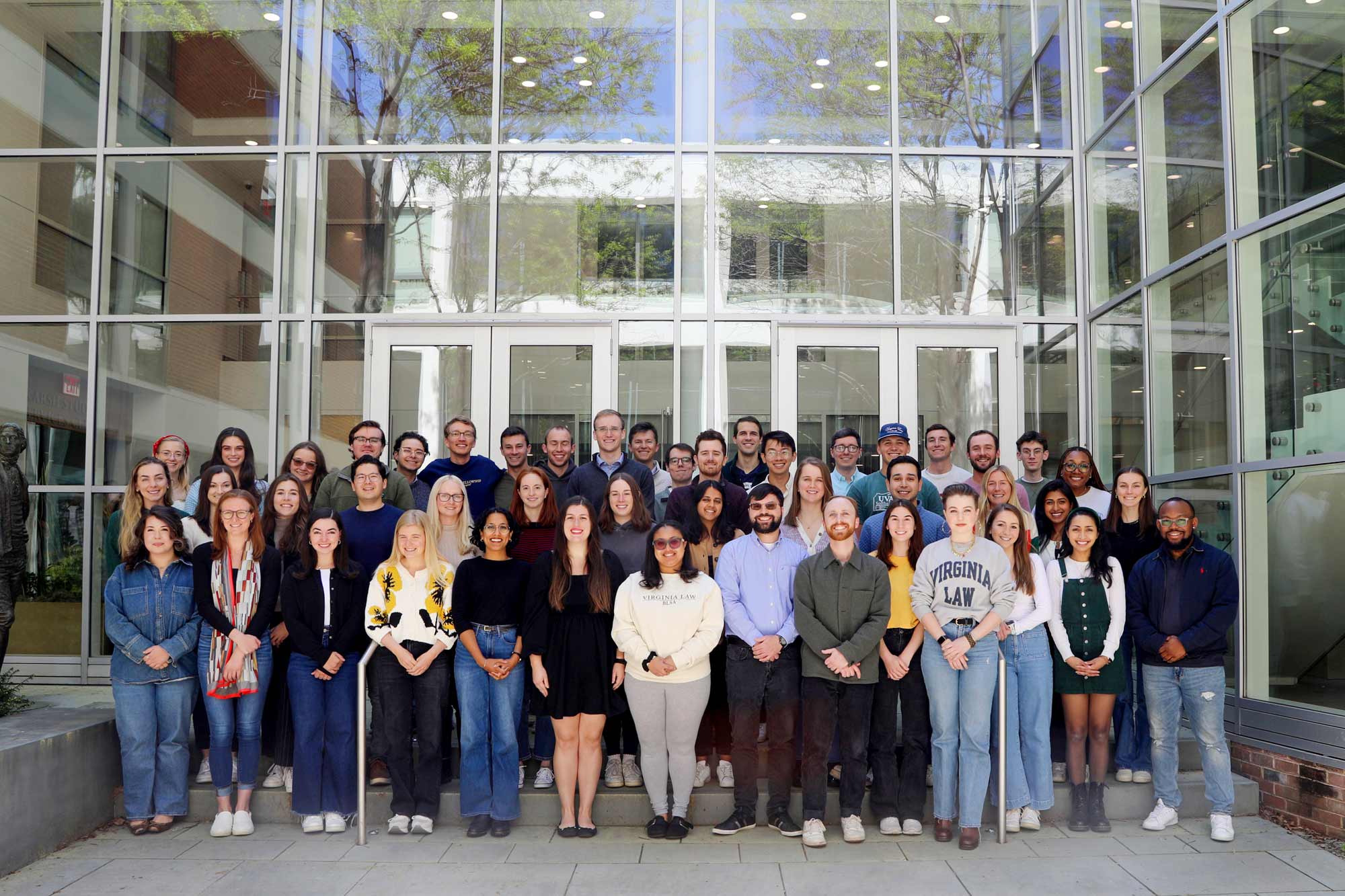 Group portrait of Class of 2025 graduates gather for a reception hosted by the Law School’s Judicial Clerkships Office