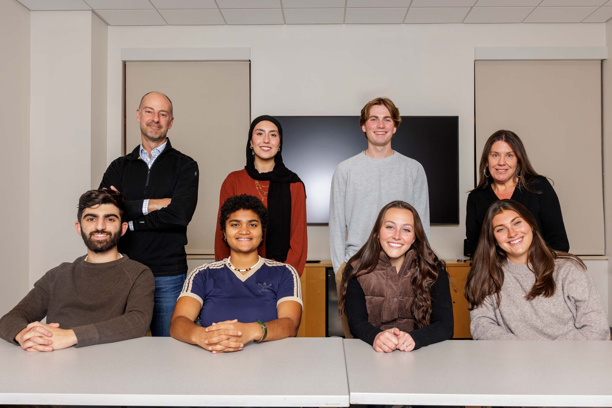 Portrait of group of UVA Department of Politics honors students with professors Jennifer Lawless and Todd Sechser.