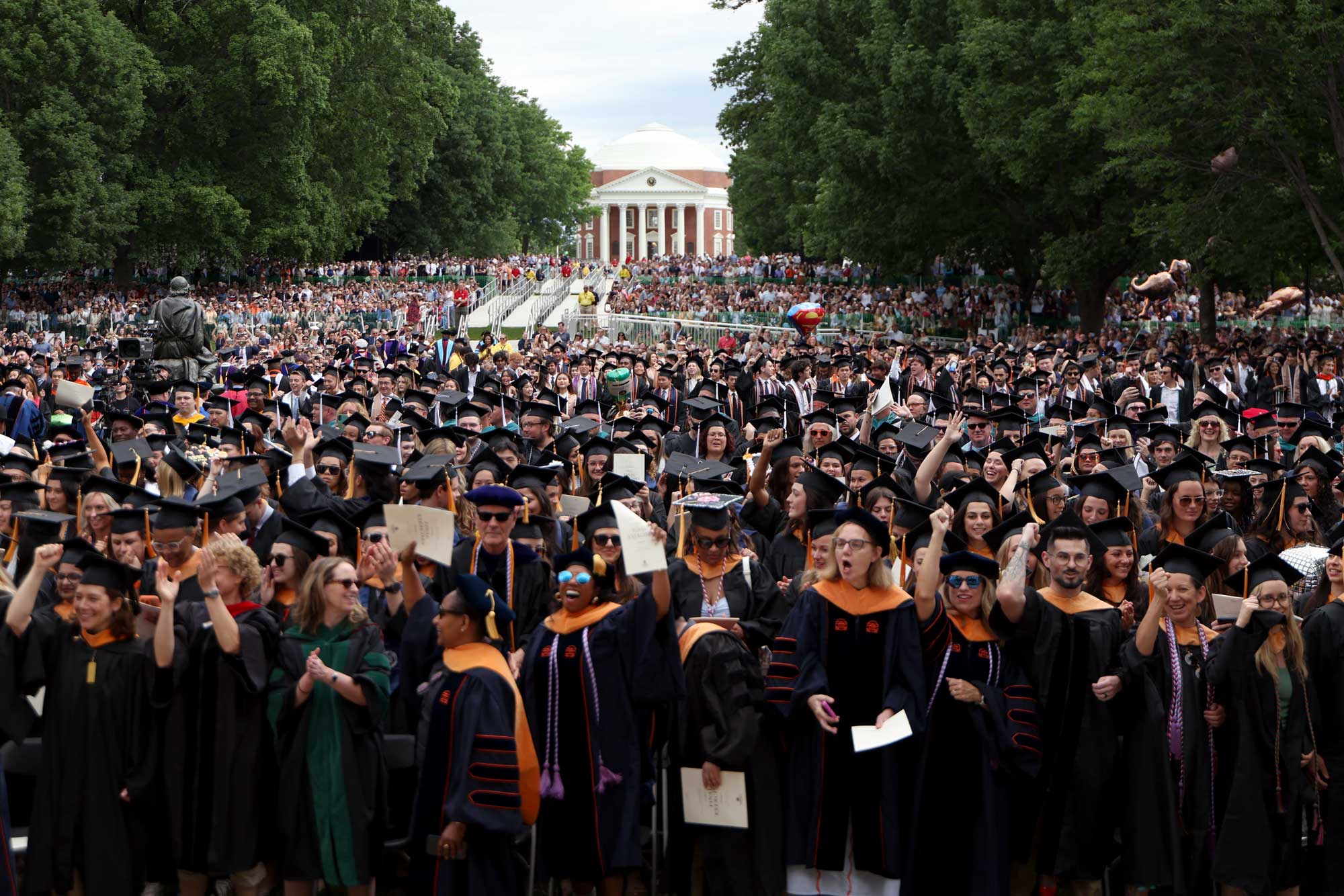 The 2025 graduates from 9 of UVA‘s 12 schools with their families and the Rotunda in the background