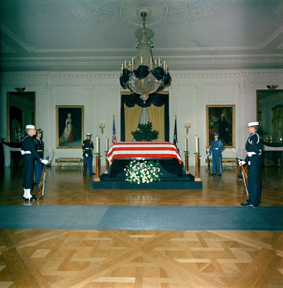 Kennedy lies in state in the U.S. Capitol Rotunda, his coffin placed on the same wooden bier, or “catafalque,” that was built for Lincoln. 