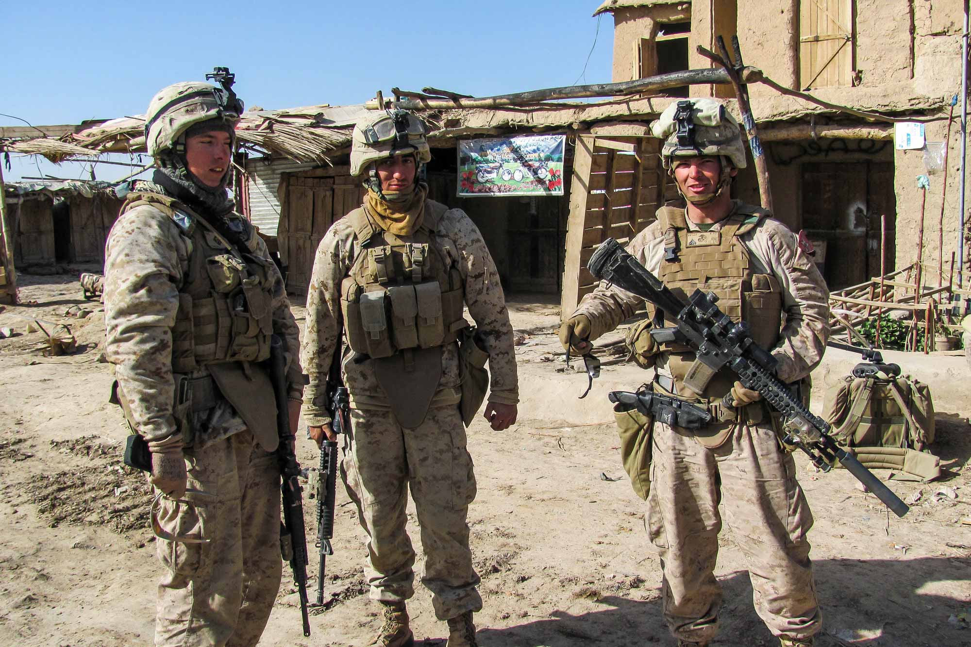 Stephen Canty to the right of two soldiers during deployment in Afghanistan