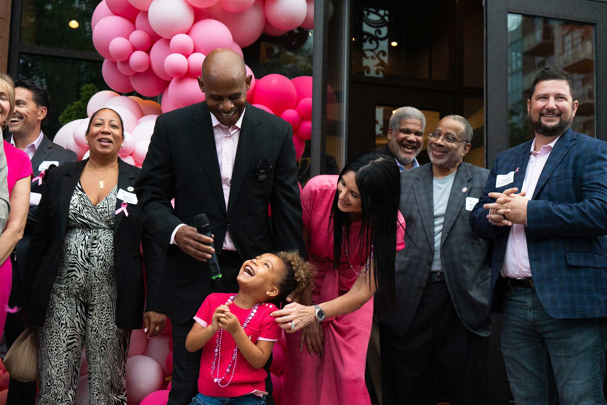 Thompson enjoys a moment with his wife, Danielle, and daughter, Skylar, during the October grand opening of the Hen Quarter Prime restaurant in Washington, D.C. 