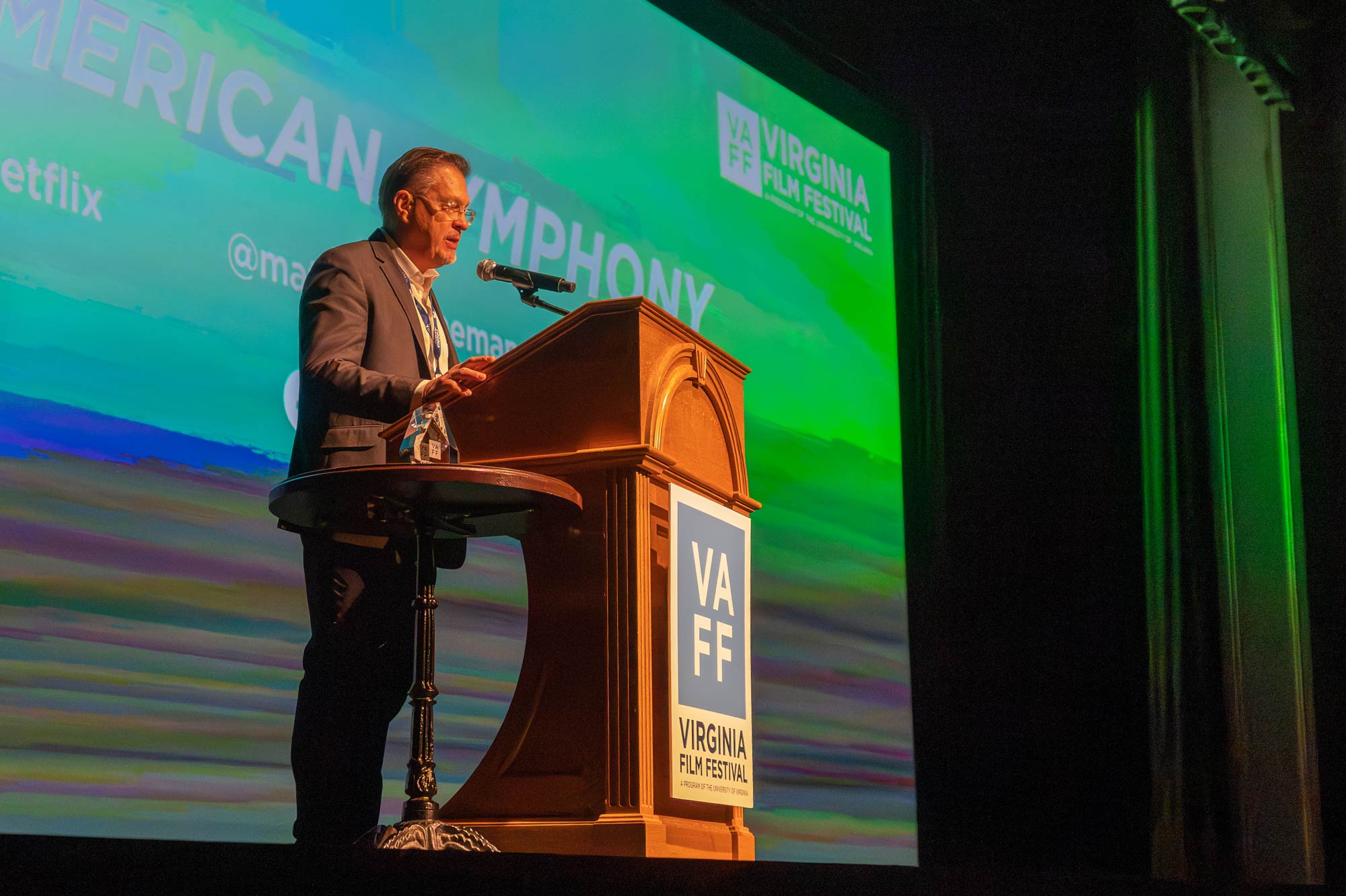 Jody Kielbasa talking at a podium in the Paramount Theater