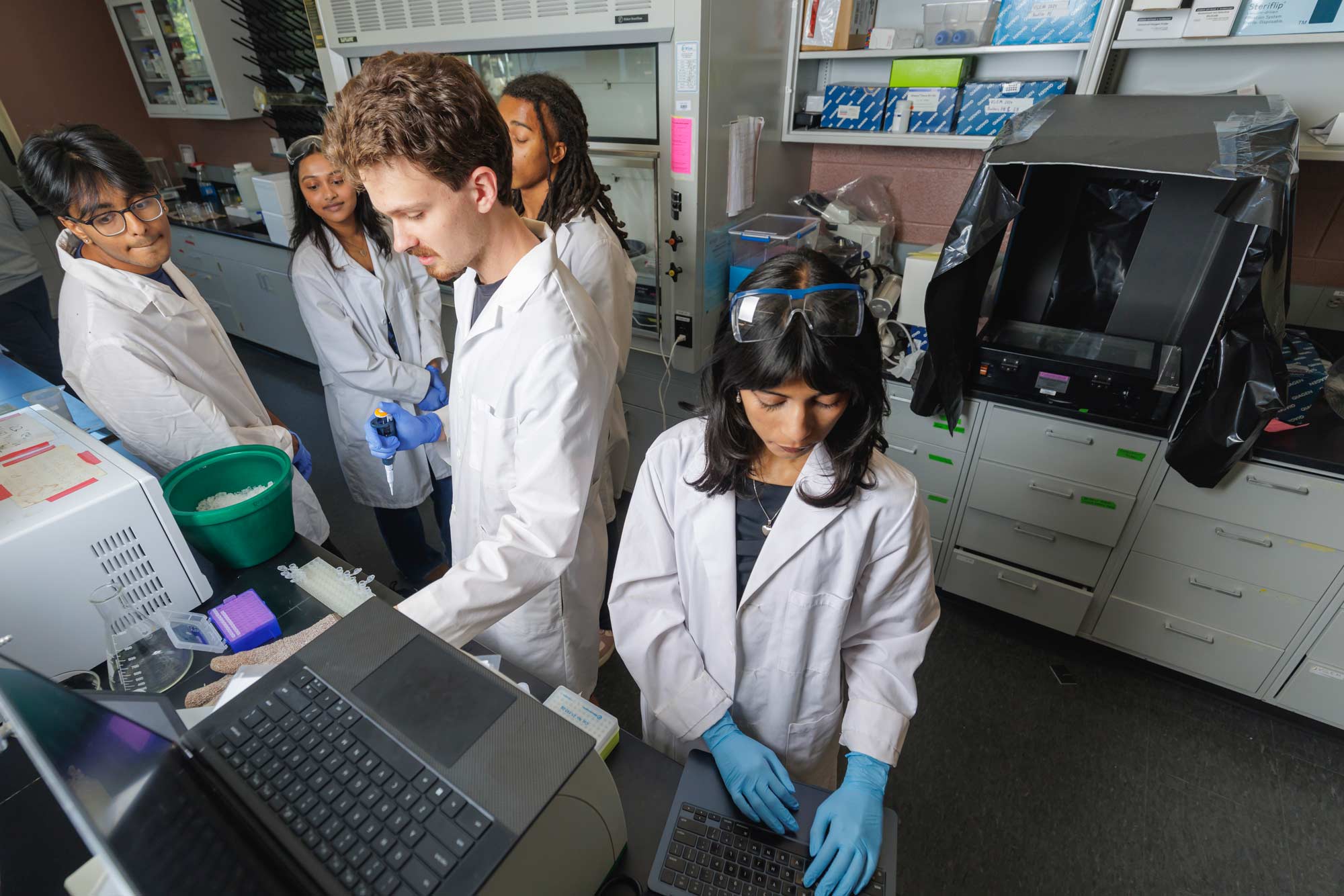 a team of UVA biomedical and bioengineering students conducting research.