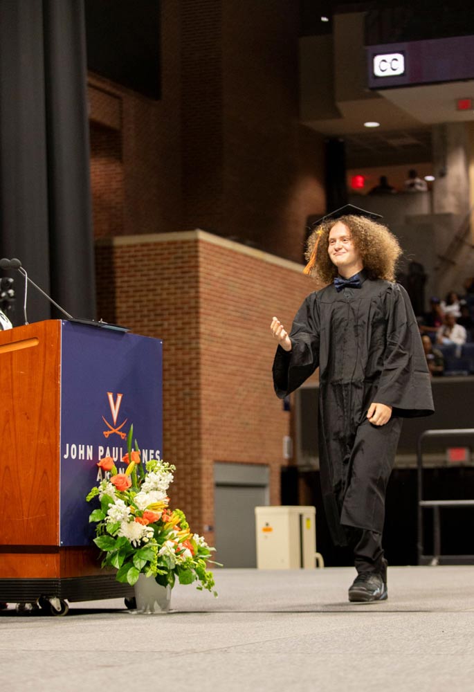 Portrait of Nicholas Brown receives his diploma from Charlottesville City Schools’ Lugo-McGinness Academy.