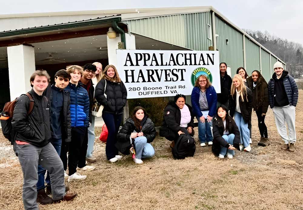 Portriat of UVA students gather at Appalachian Harvest.