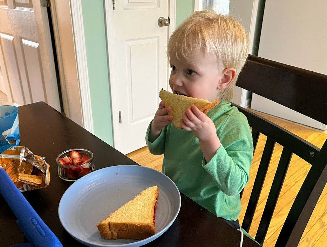 Cole Copeland trying a peanut butter sandwich