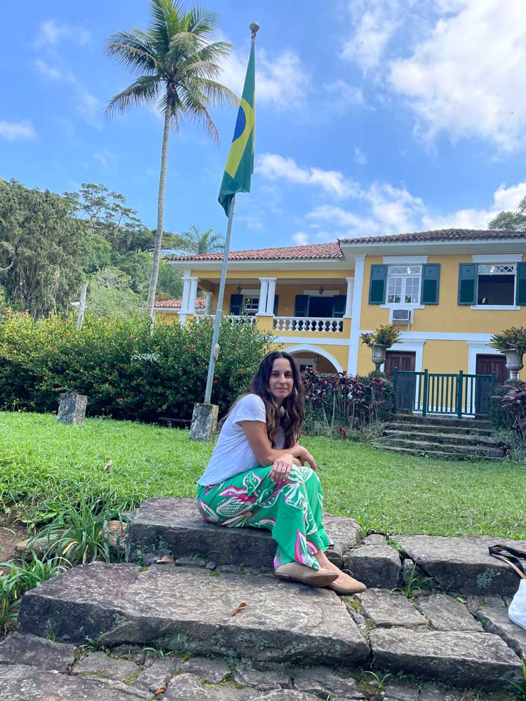 Portrait of Kathiane Schinelli sits in the Rio de Janeiro Botanical Gardens