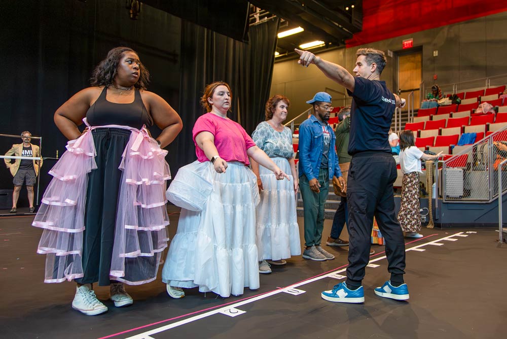 Matthew Steffens directing actors during rehearsal of ’Into the Woods’