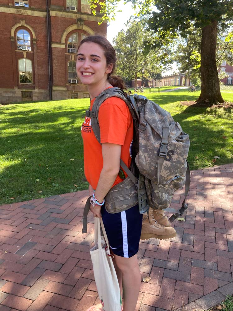 Rebecca Fitch with her army backpack in front of the Rotunda