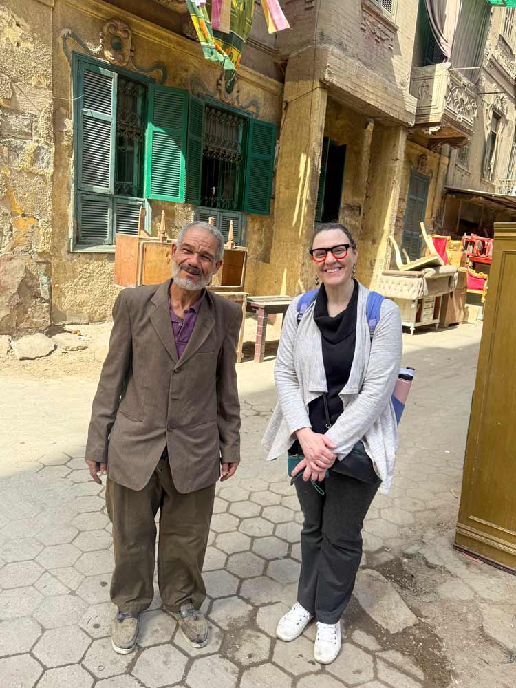 Tessa Farmer stands with a local community member in Cairo, Egypt