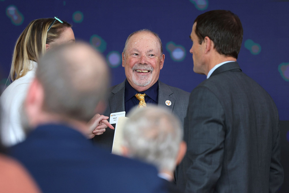 Philip Bourne, the Stephenson Dean of the School of Data Science, talks to UVA President Jim Ryan at the ribbon-cutting 