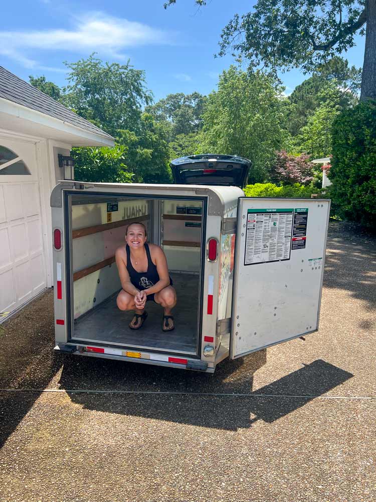 Brynn Earl in the back of their moving trailer