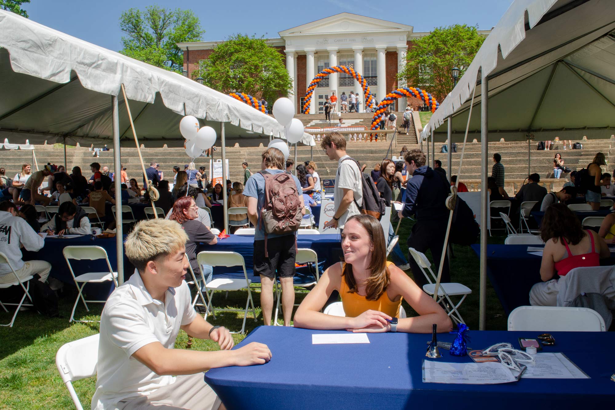 Lile-King and Gabriel Hwang talking at the Thank You note writing event held on the Lawn in front of the Rotunda