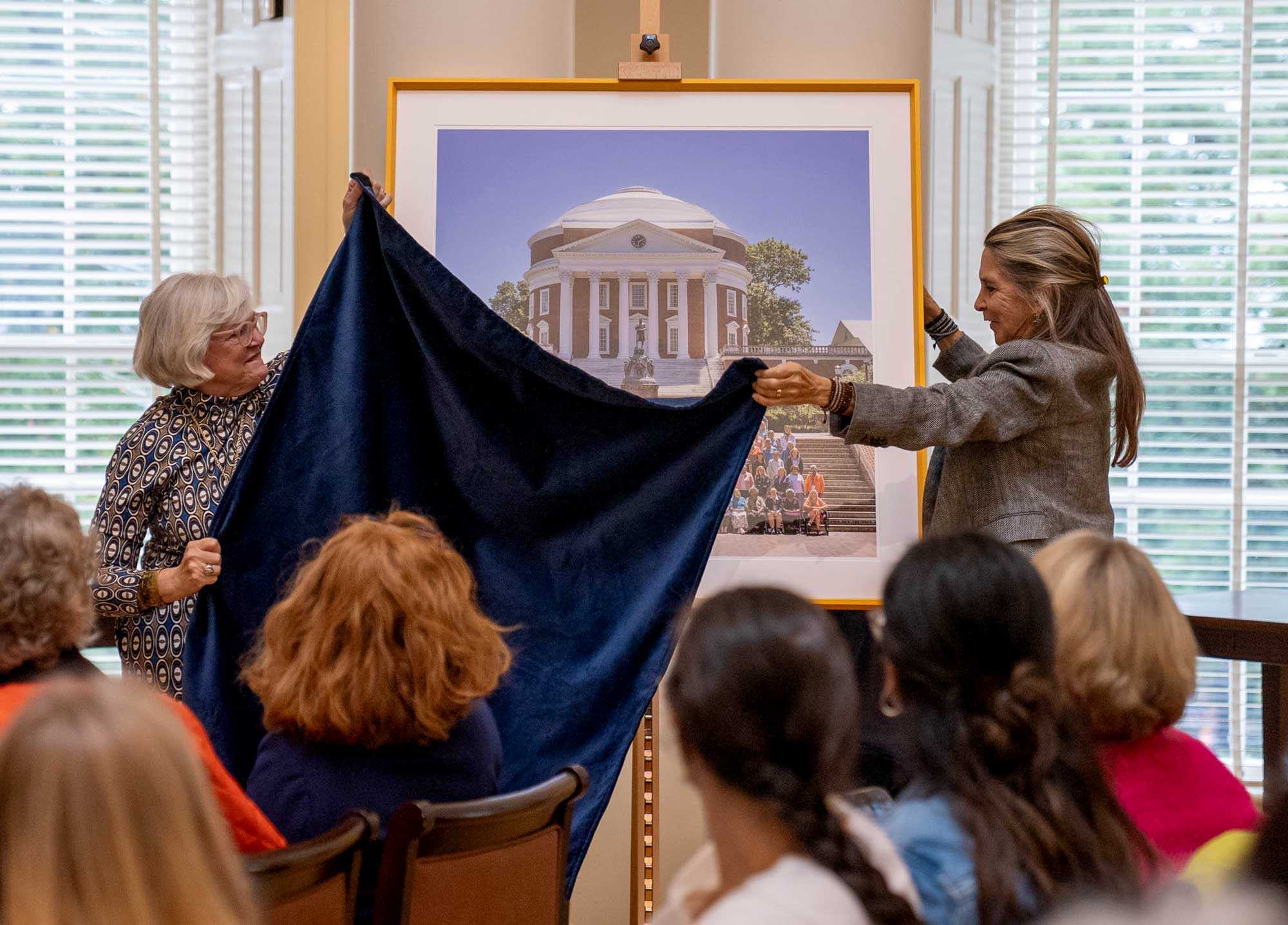 Ann Brown, left, and Betty Shotton unveil the portrait