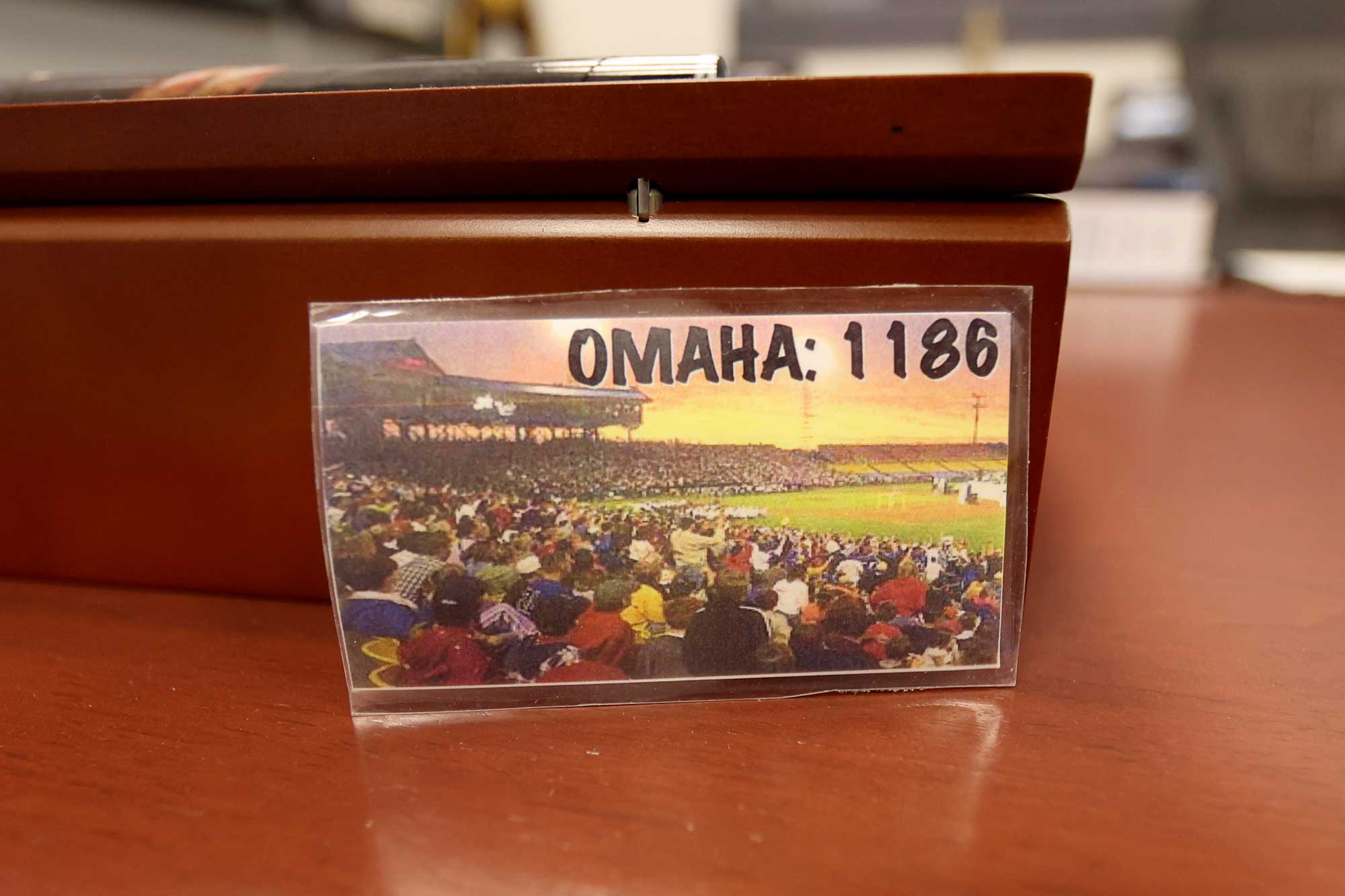 An old laminateed business card that says Omaha: 1186