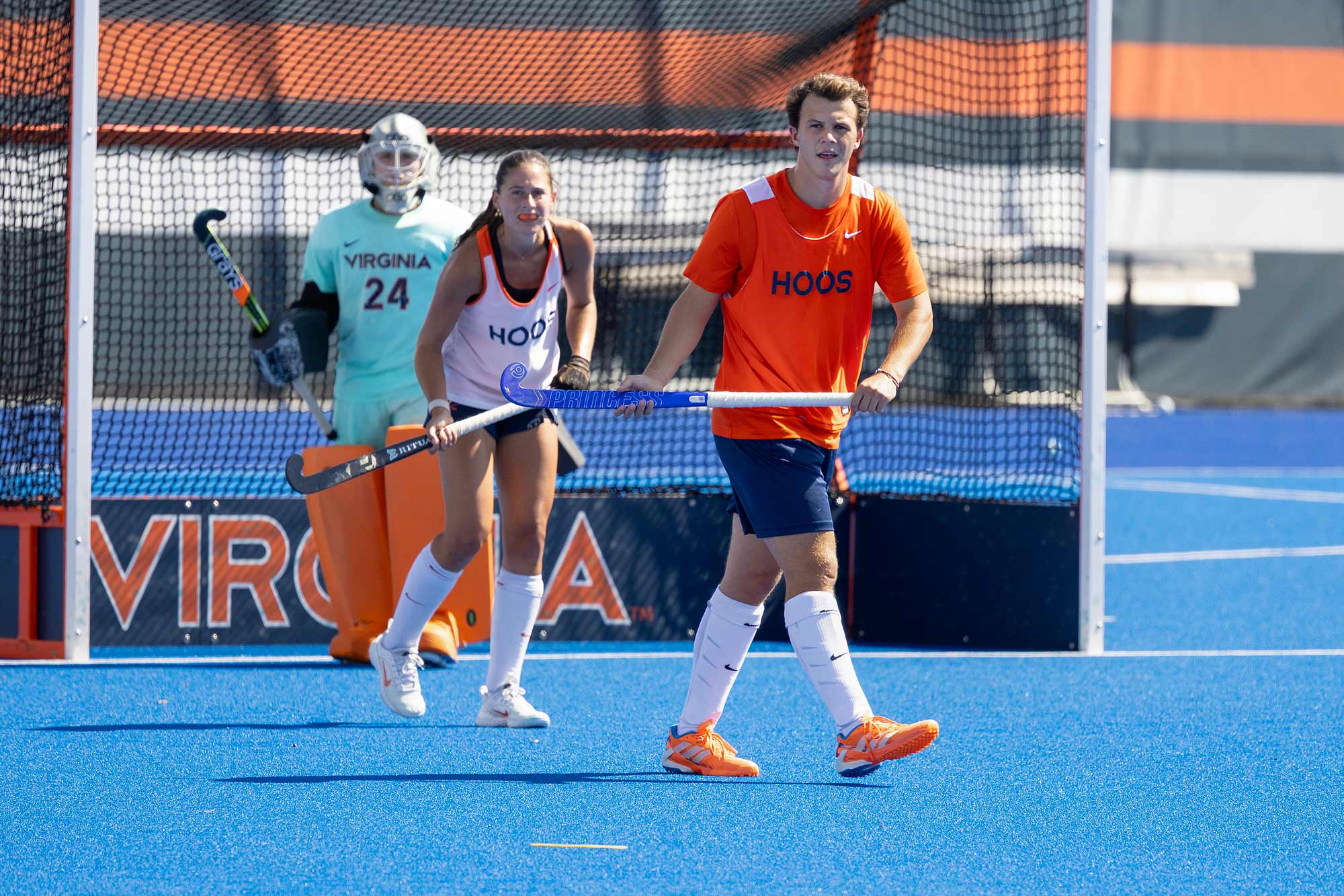 Candid of Charlie Webb playing field hockey
