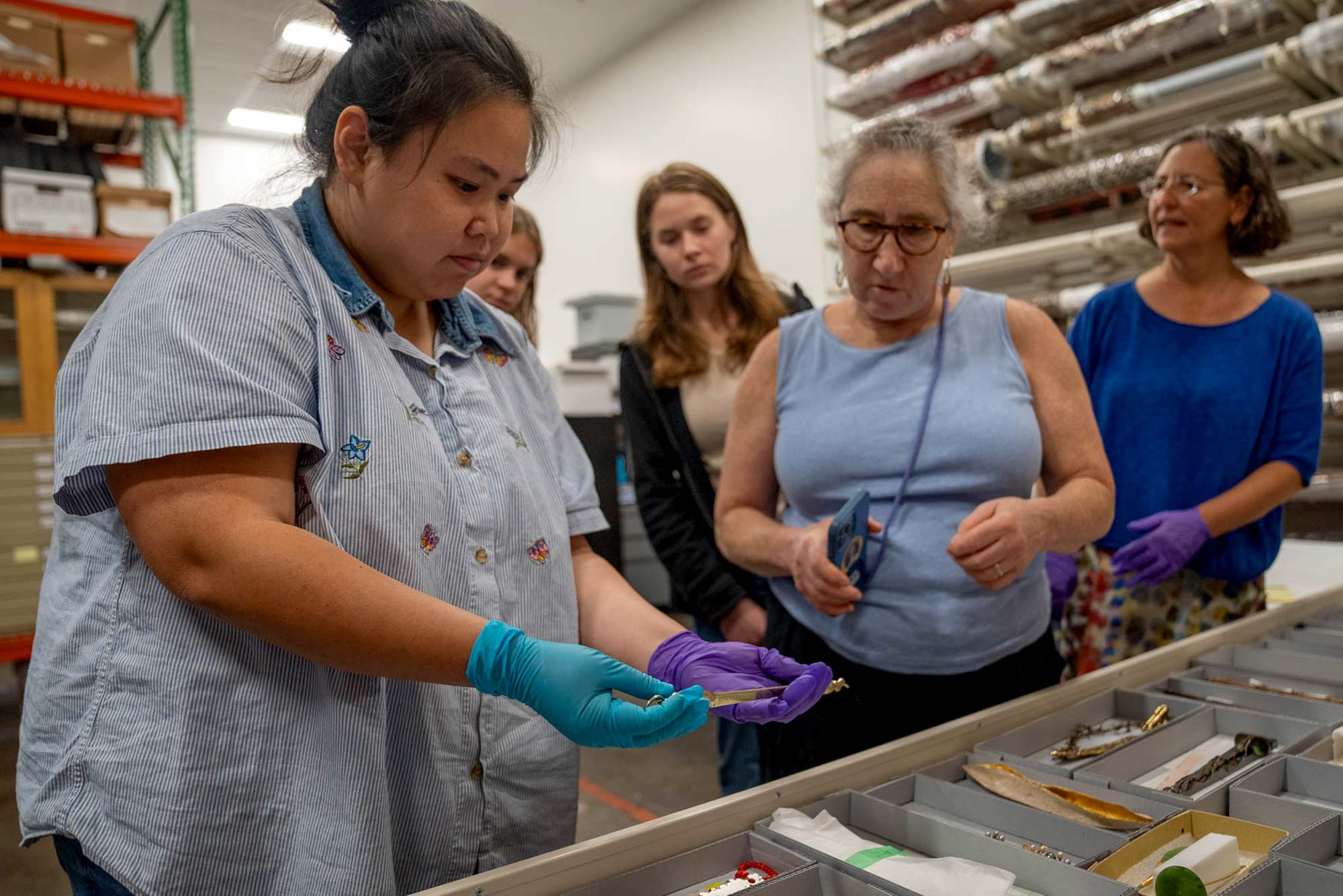 Assistant registrar Phuong Duyen Hai Nguyen displays one of the yads from the collection 