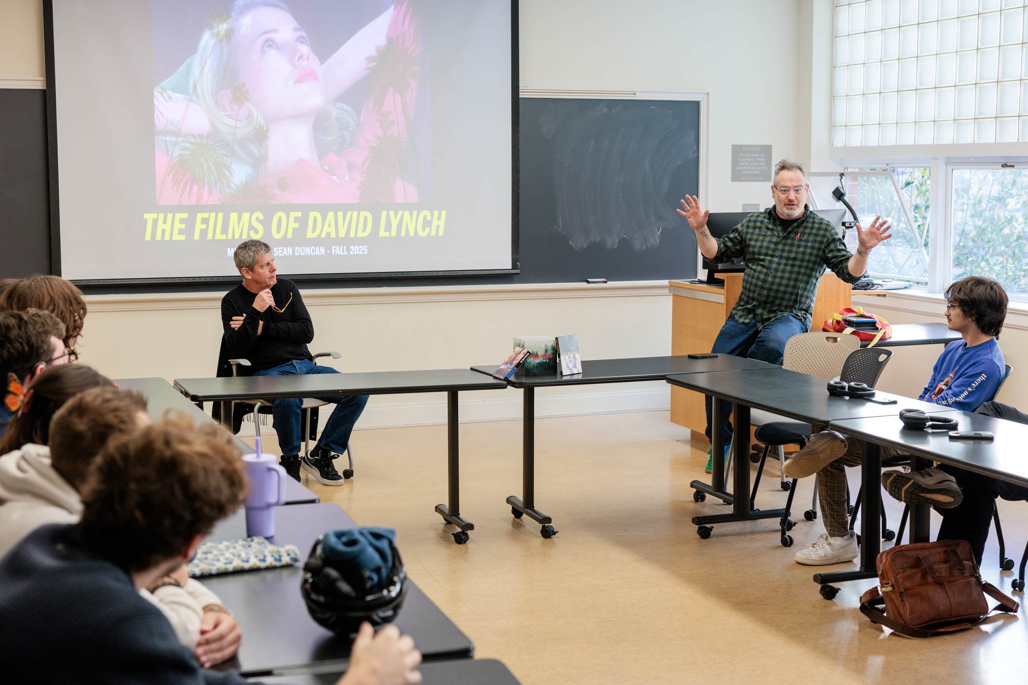 Assistant Professor Sean Duncan speaking to a media studies class with Deming talking on the films of David Lynch.