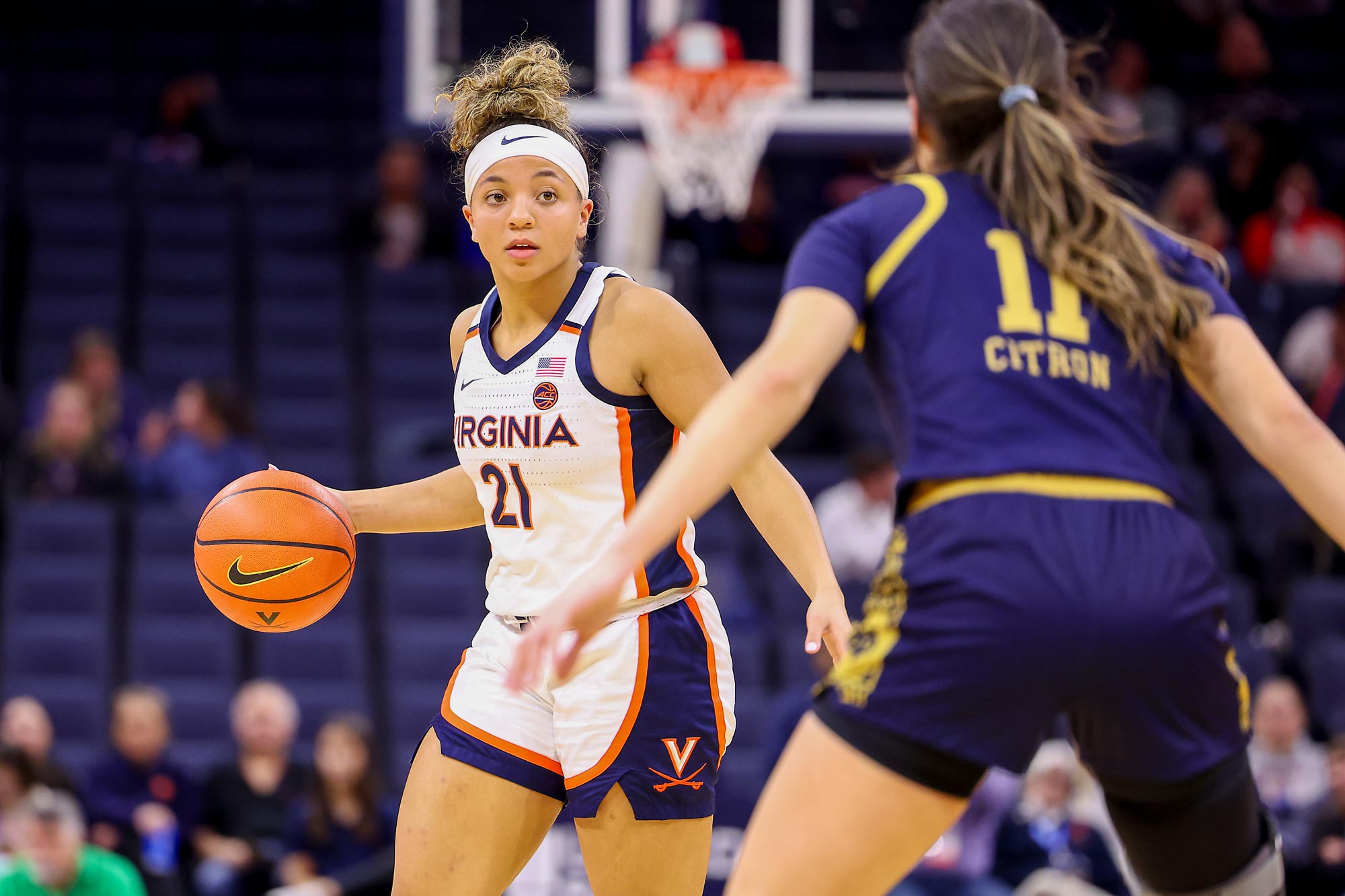 Kymora Johnson playing basketball during a UVA game