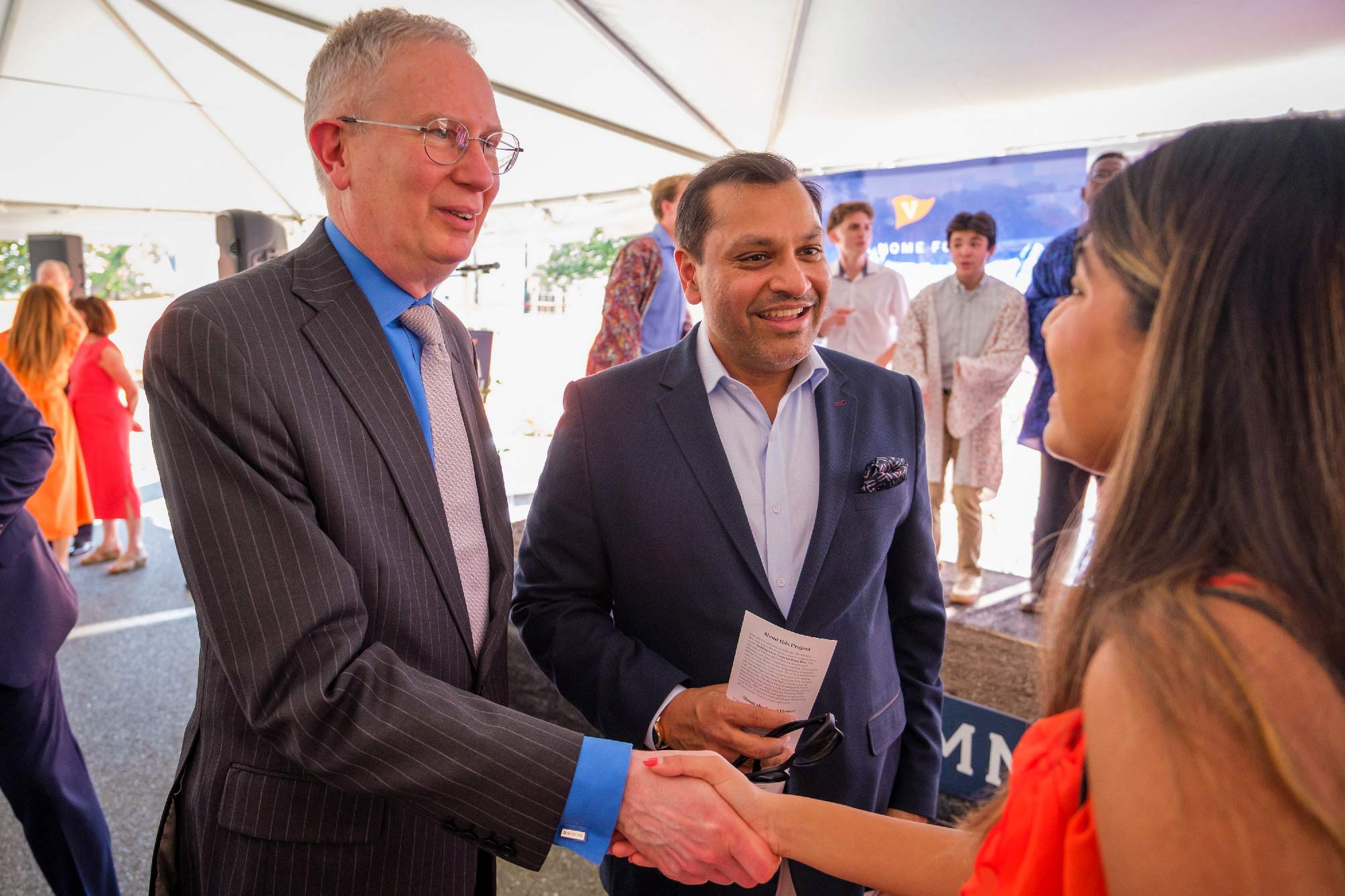 Candid Portrait of Interim University President Paul Mahoney and donor Reggie Aggarwal.