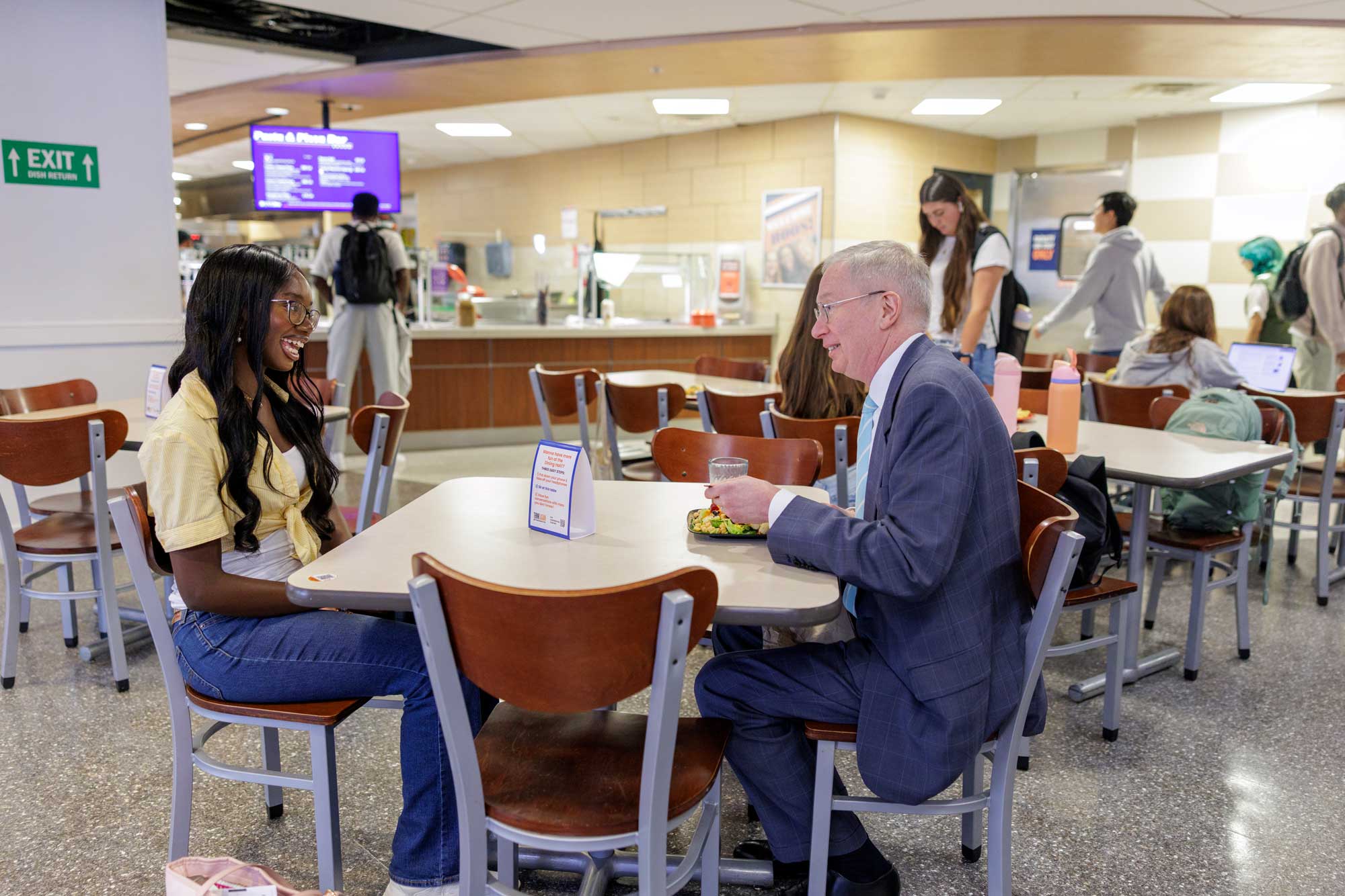 Manuela Kodwo sitting across from Mahoney in the Newcomb Hall cafeteria.