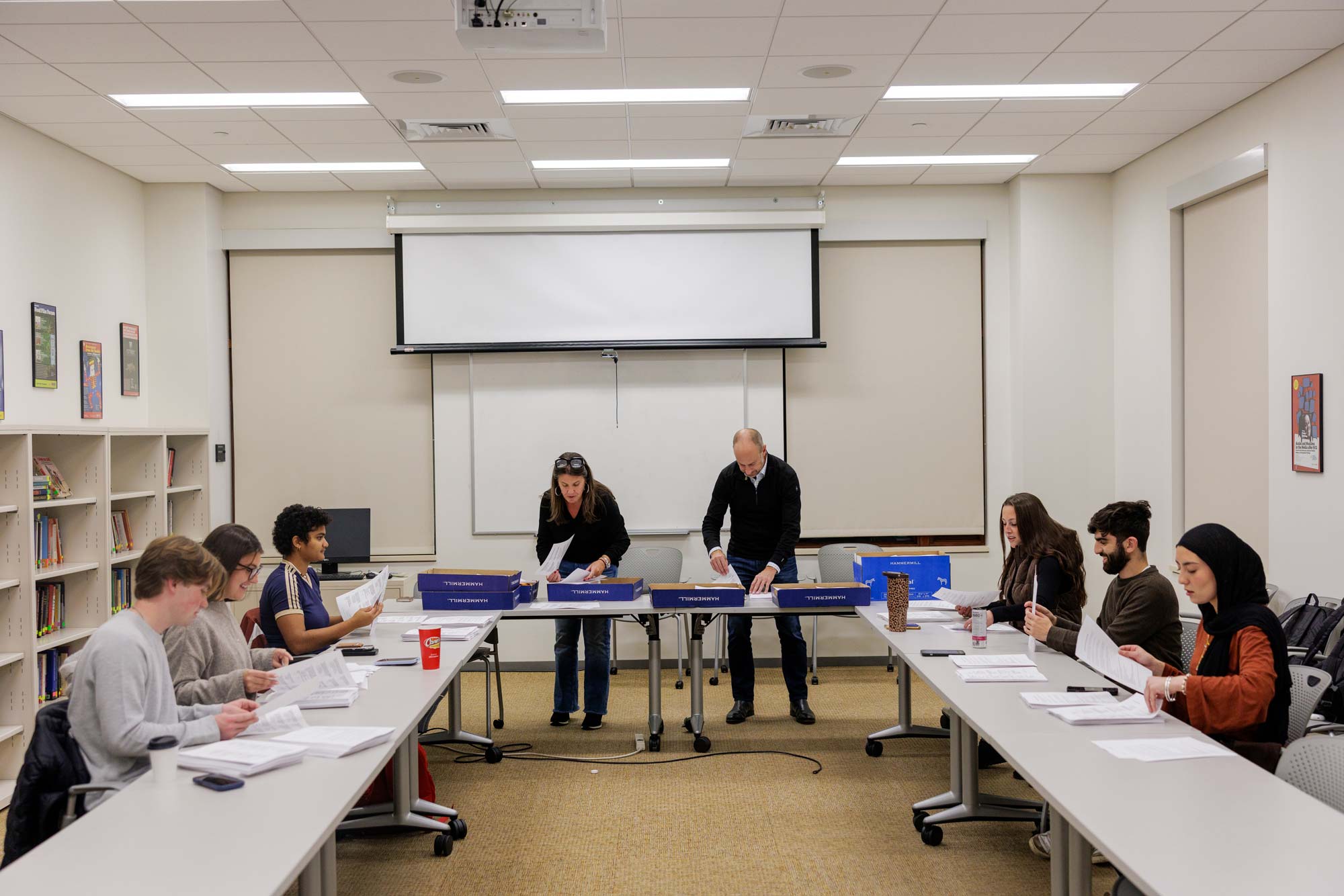 A group of student in a classroom, in the front row and from the left, Hovsep Seferian, Jada Fontaine-Rasaiah, Grace Edelstein and Kessler Kreutner-Eady. In the back row, from left, are honors program director and professor Todd Sechser, Maryam Ahmed, Zach Davidson and Department of Politics chair and professor Jennifer Lawless.