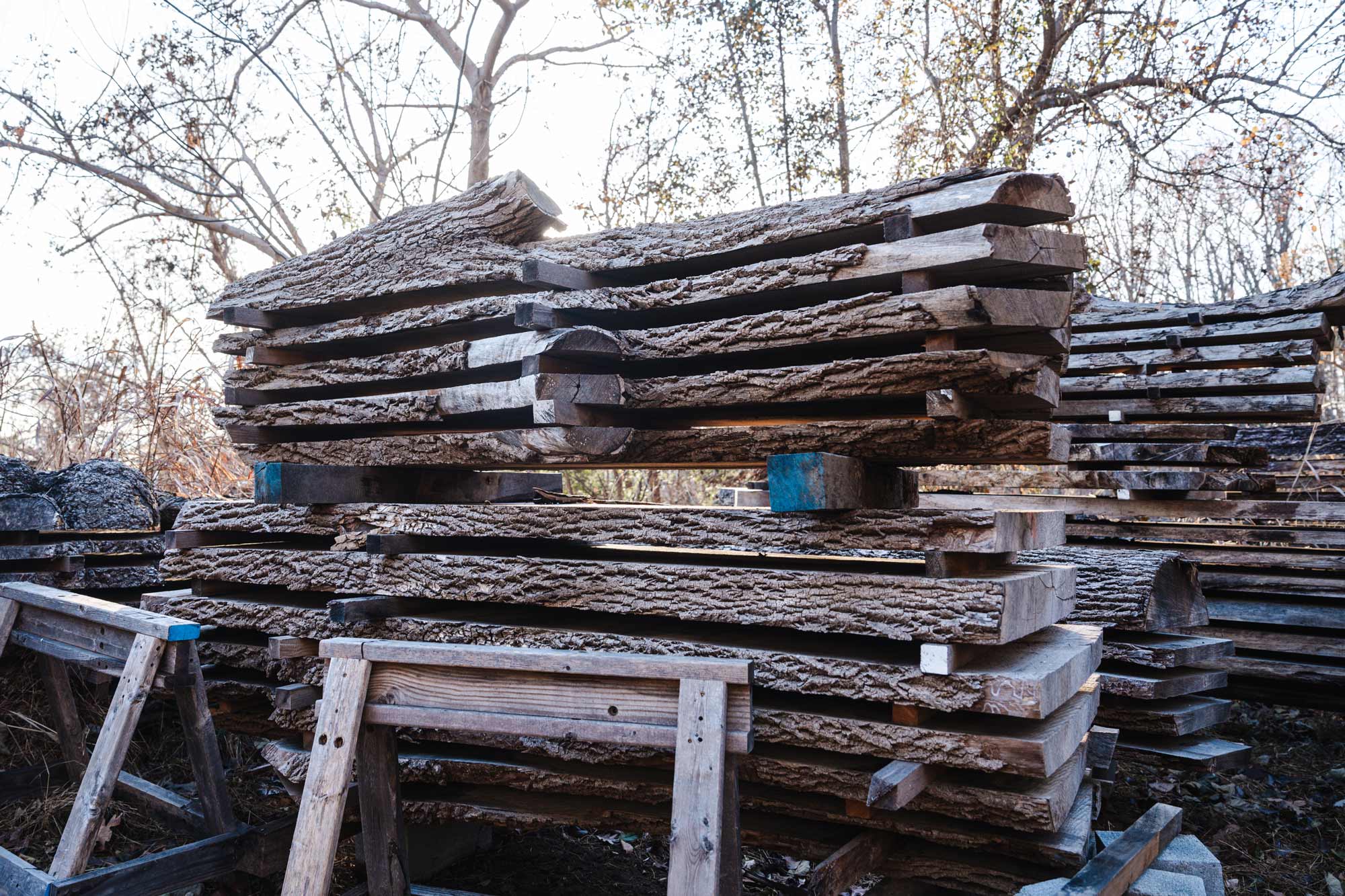 Piled, flattened and dried wood slabs stacked on top of each other