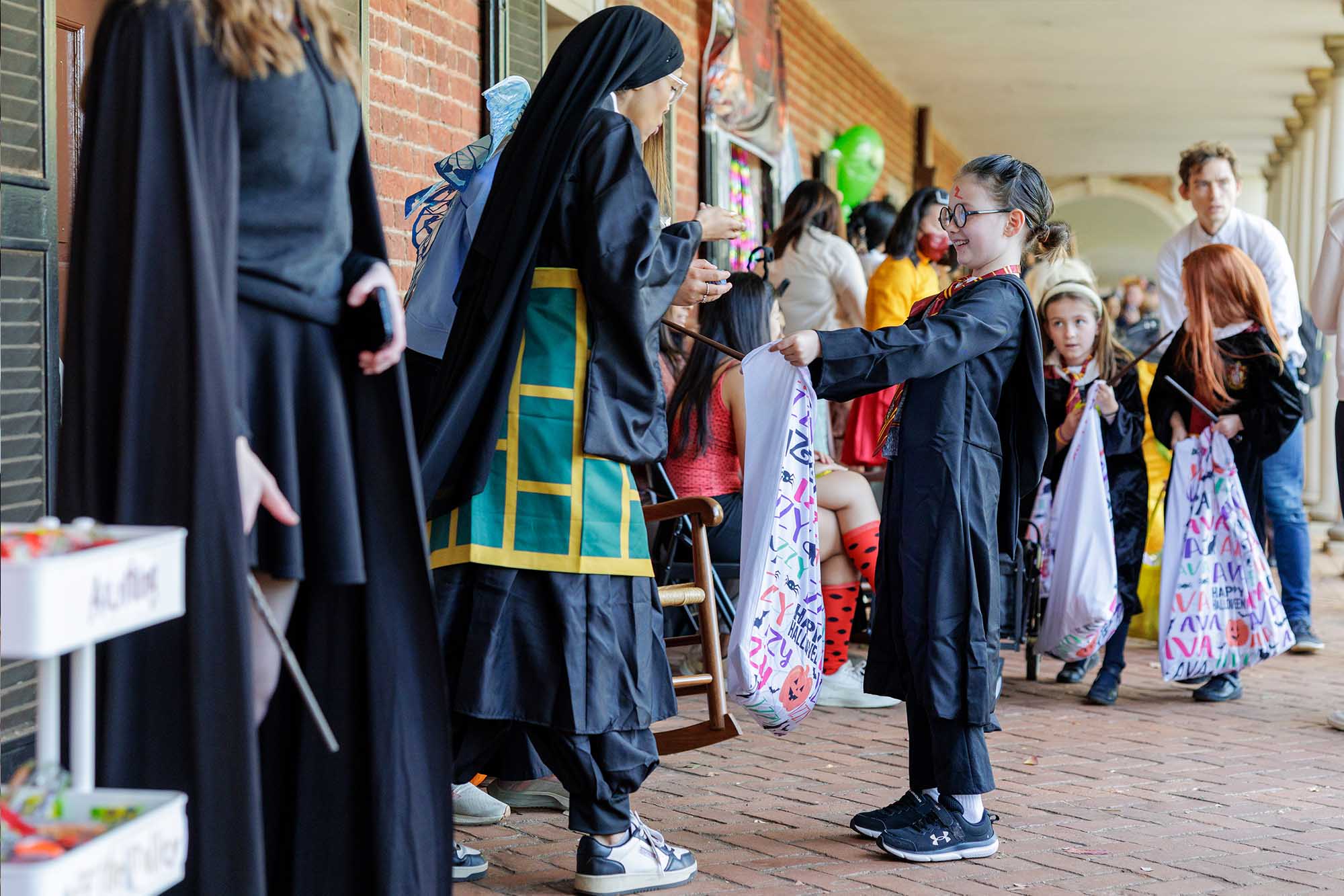 Izzy Baudinet trick or treating as a Hogwarts student