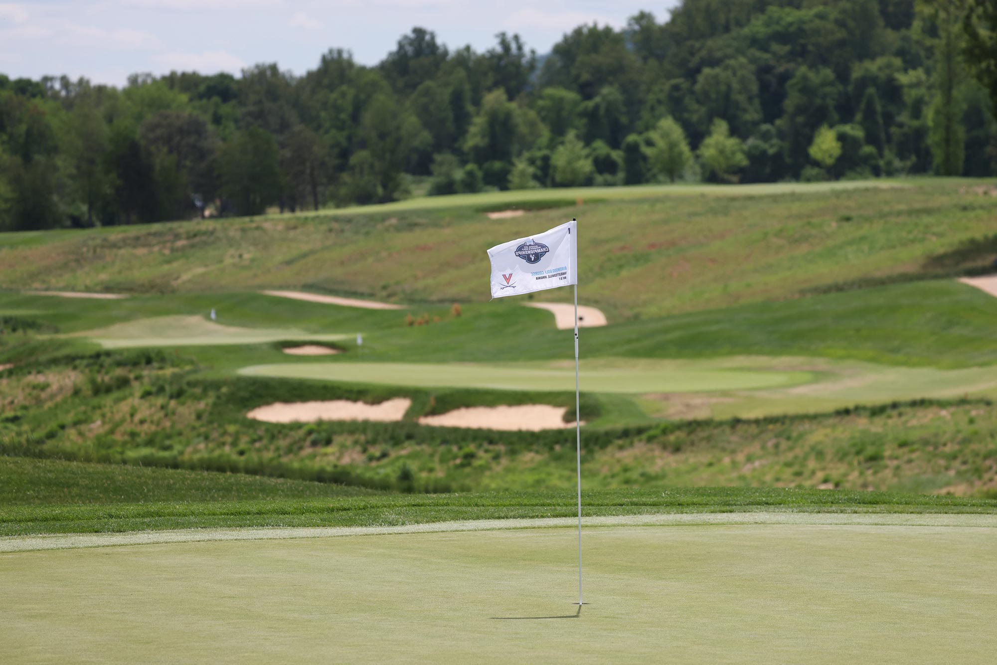 The 2025 ACC championship flags flying at the Boar’s Head golf course