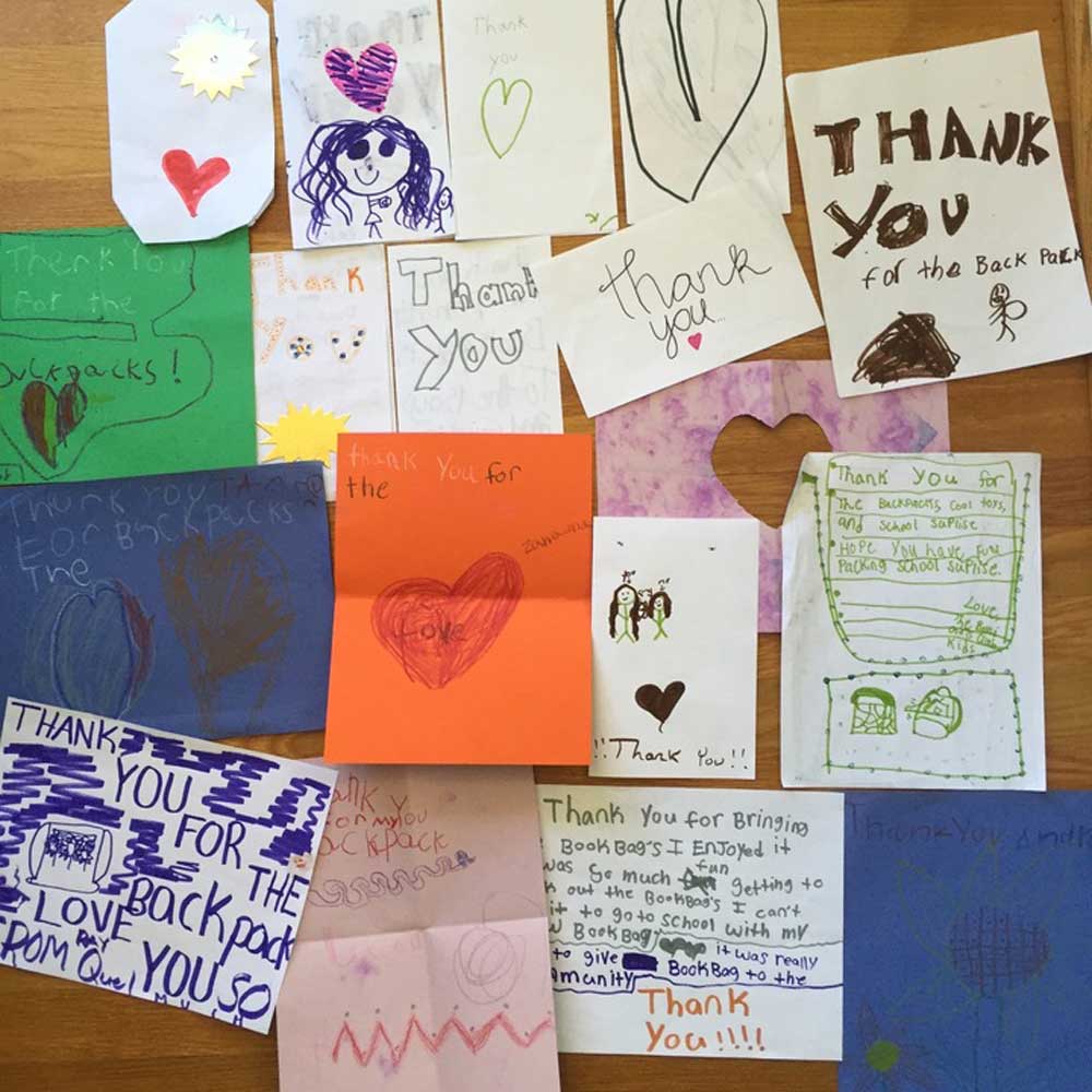 bulletin board covered in “Thank You” notes 