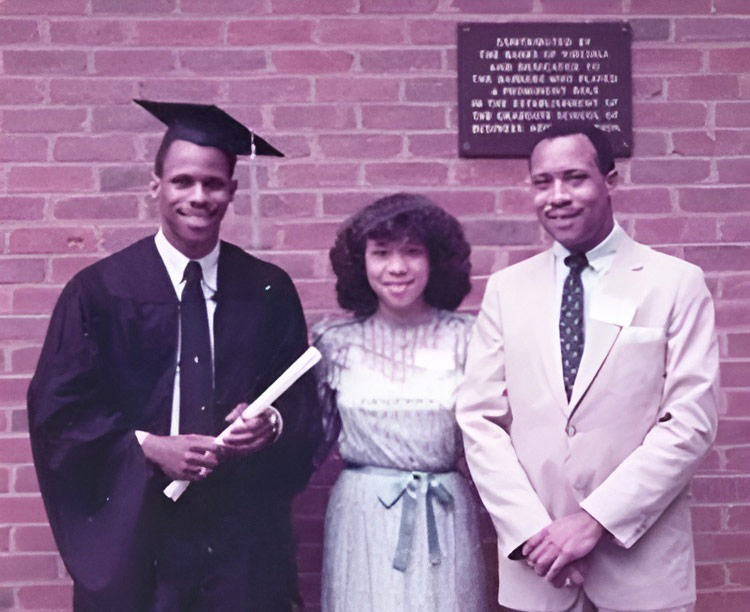 Thompson stands with his sister, Benita, and brother, Fred, during his 1983 Darden School graduation ceremony. 