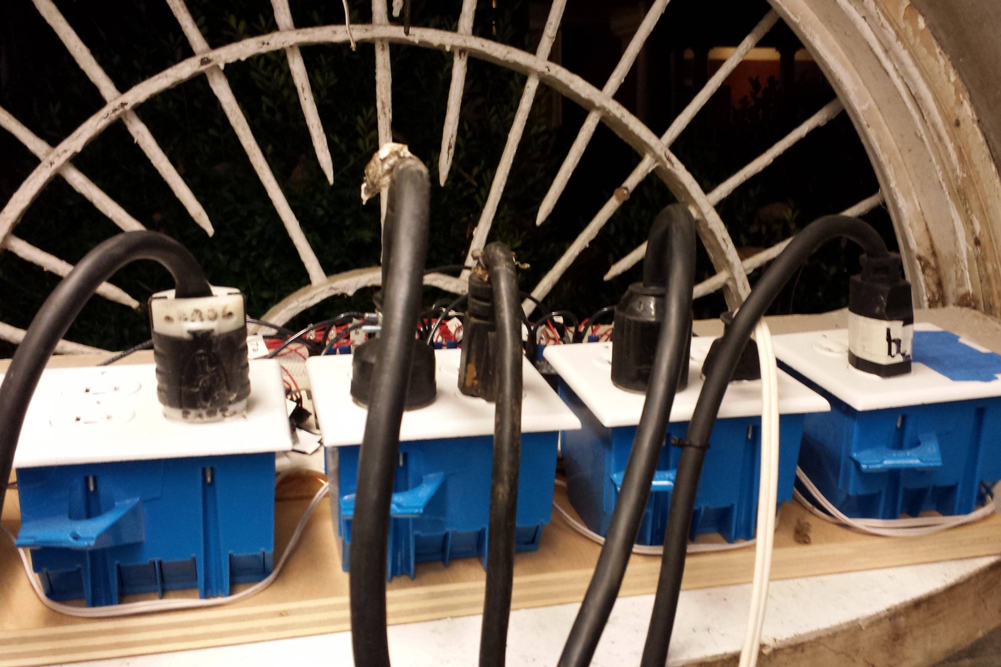 Close up of a row of outlets and thick power cords from the 2012 Lighting of the Lawn