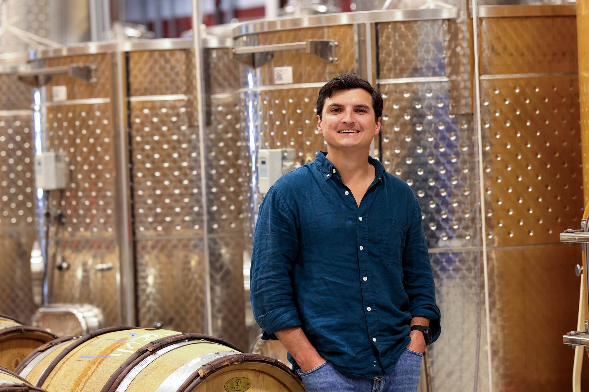 Portrait of Patt Eagan within his wine production facility.